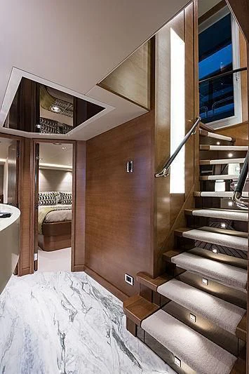 a wooden staircase in a house aboard HAT TRICK Yacht for Sale