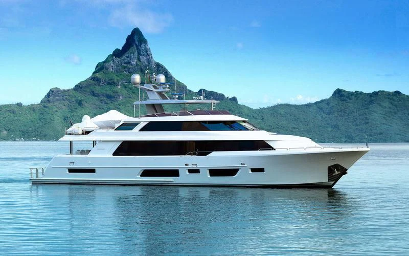 a white yacht in the water aboard HAT TRICK Yacht for Sale