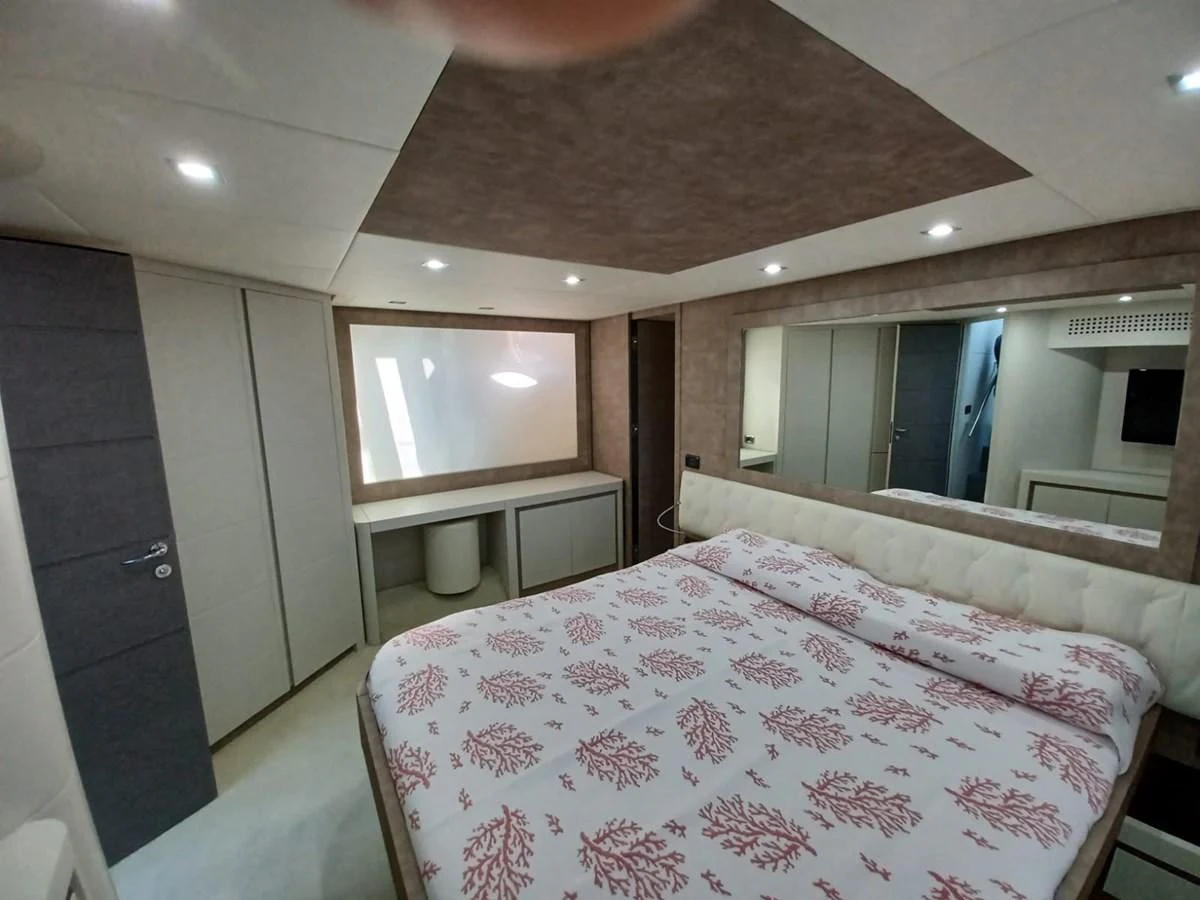 a bed in a room aboard PERSHING 72 Yacht for Sale