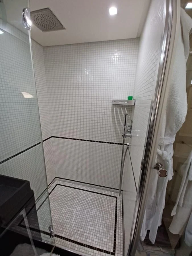 a shower unit in a bathroom aboard PERSHING 72 Yacht for Sale