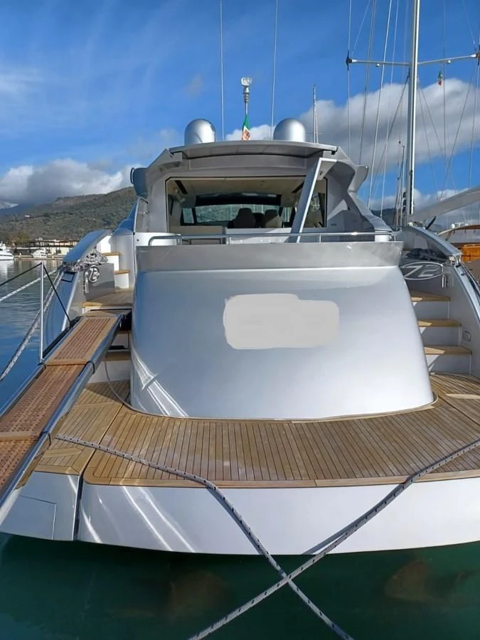 a boat on a deck aboard PERSHING 72 Yacht for Sale