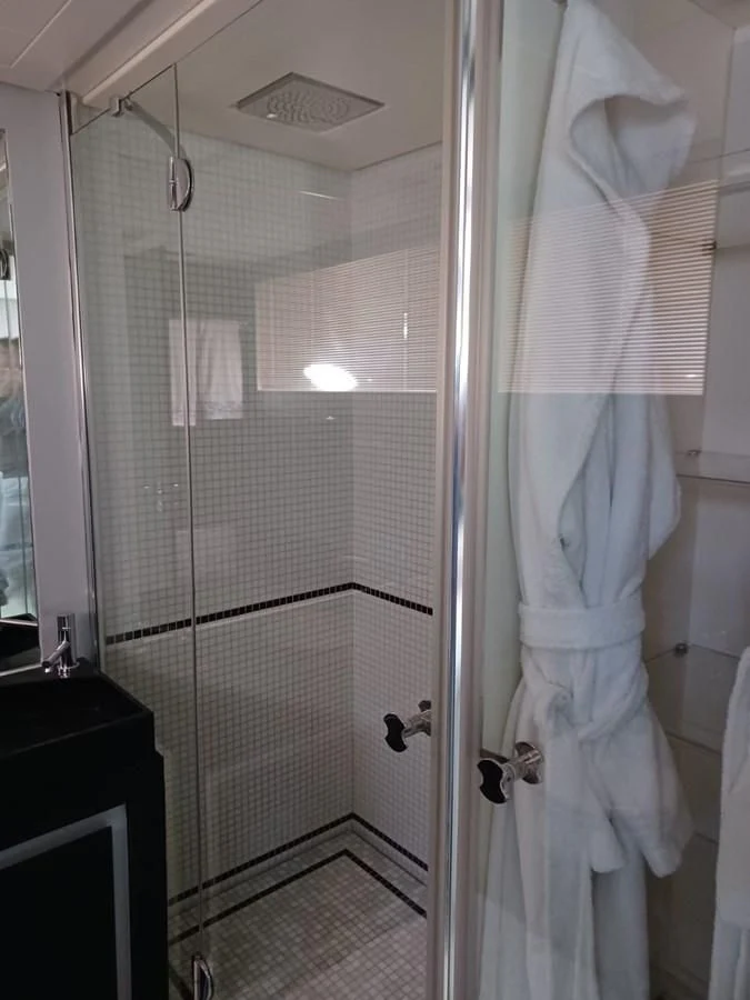 a shower with a glass door aboard PERSHING 72 Yacht for Sale
