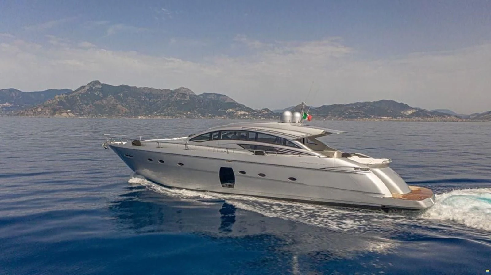 a white yacht on the water aboard PERSHING 72 Yacht for Sale