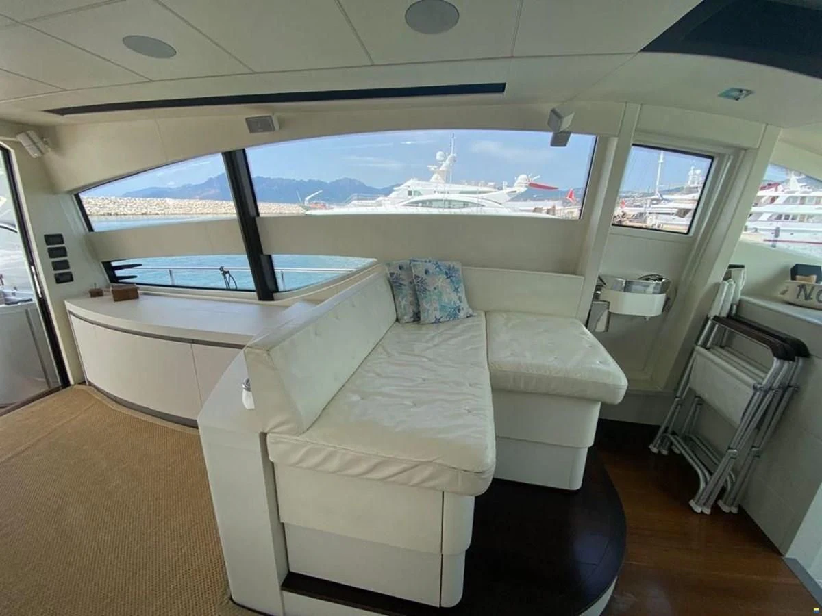 a room with a bed and a window aboard PERSHING 72 Yacht for Sale