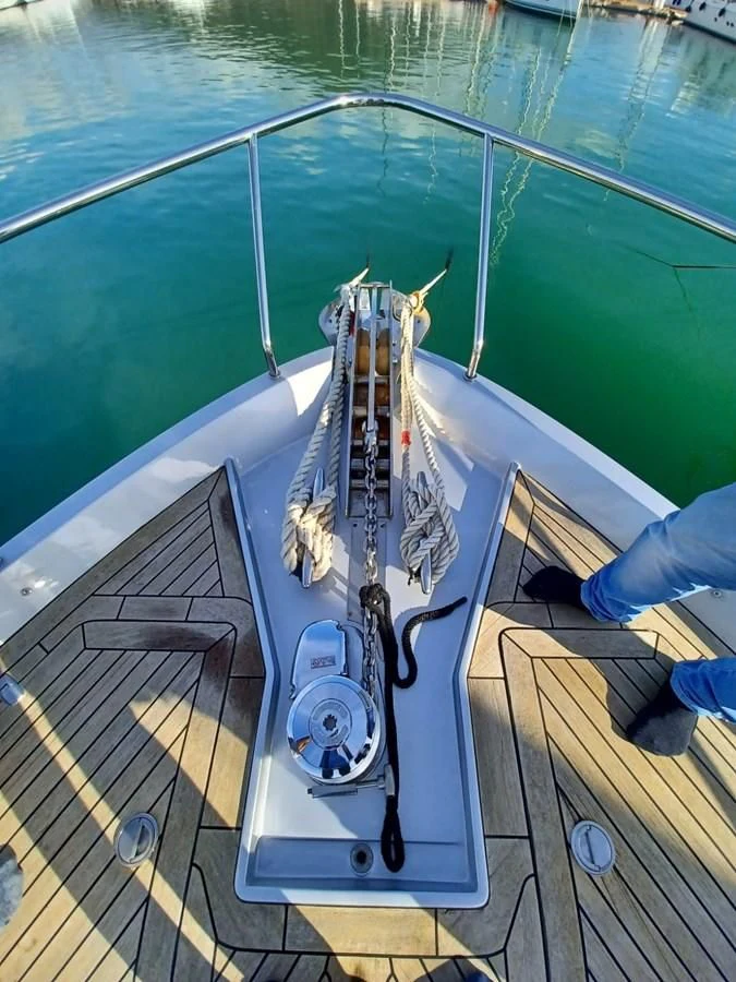 a boat on a deck aboard PERSHING 72 Yacht for Sale