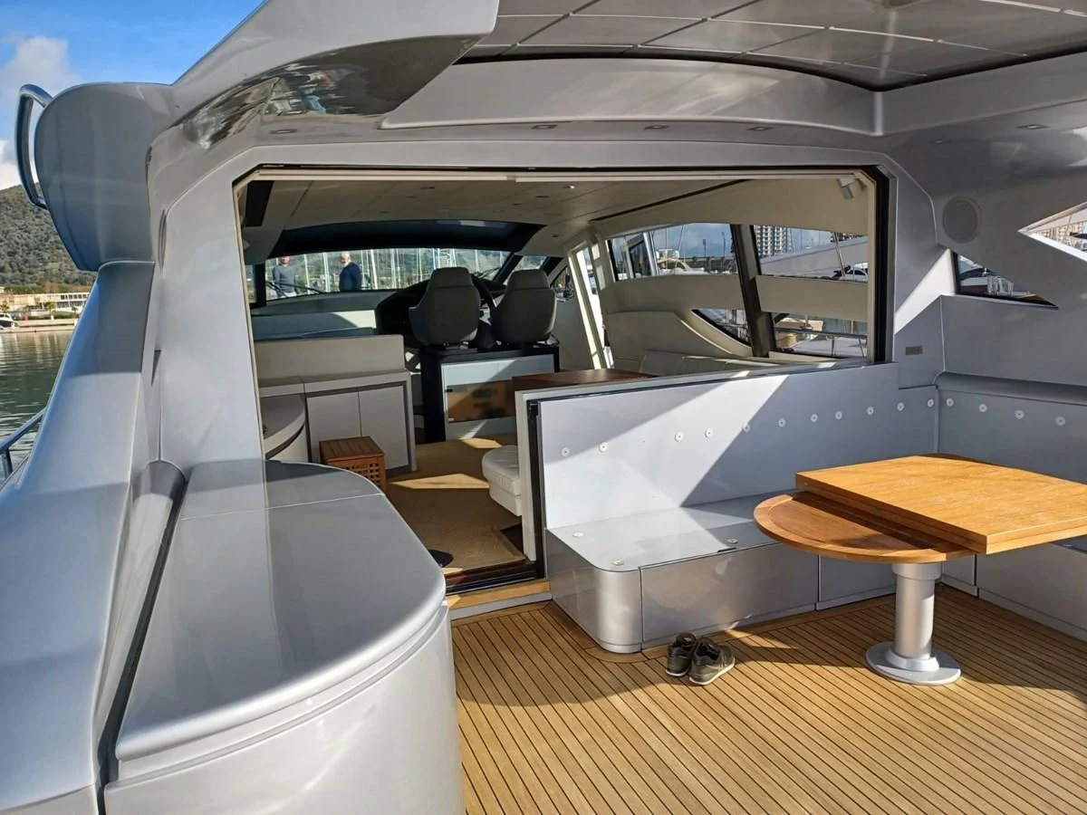 a plane with a desk aboard PERSHING 72 Yacht for Sale