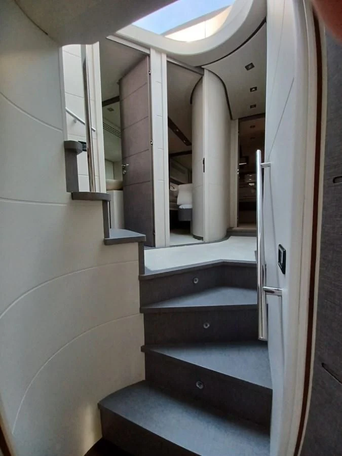 a staircase with a railing aboard PERSHING 72 Yacht for Sale