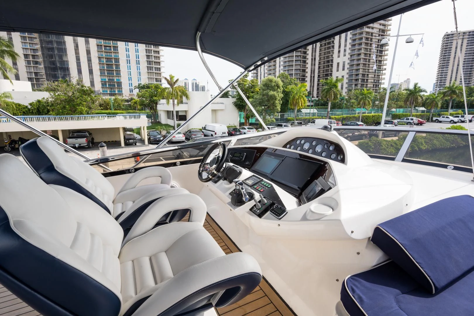 a group of cars parked in a parking lot aboard SS ARTS Yacht for Sale