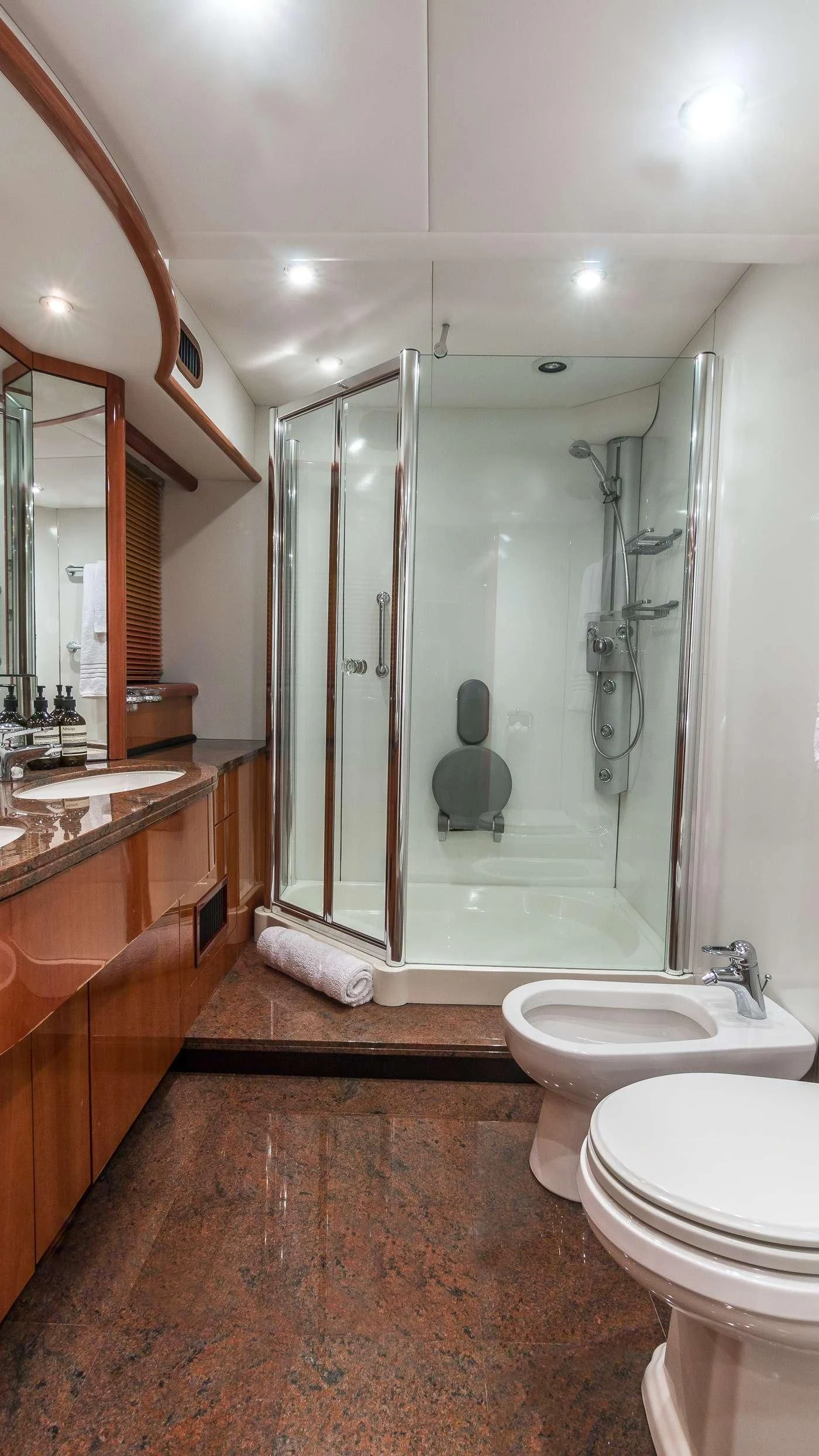 a bathroom with a glass shower aboard SS ARTS Yacht for Sale