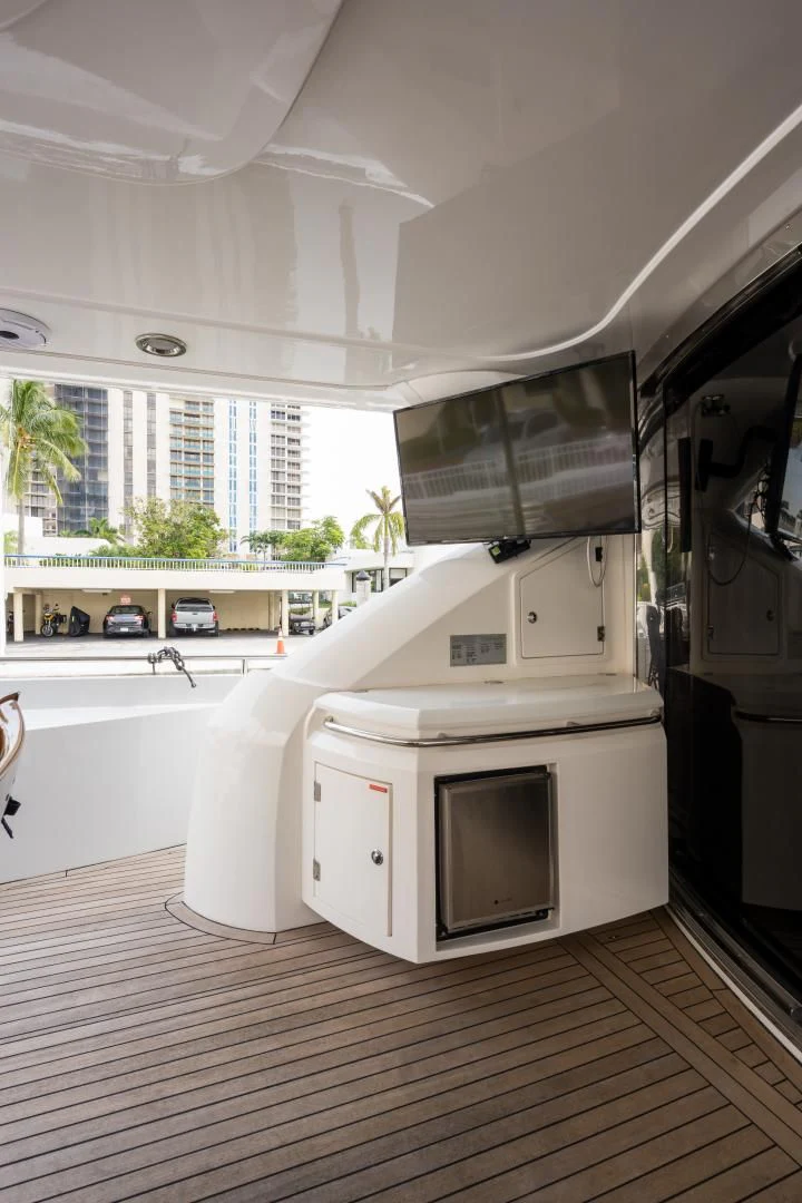a kitchen with white appliances aboard SS ARTS Yacht for Sale