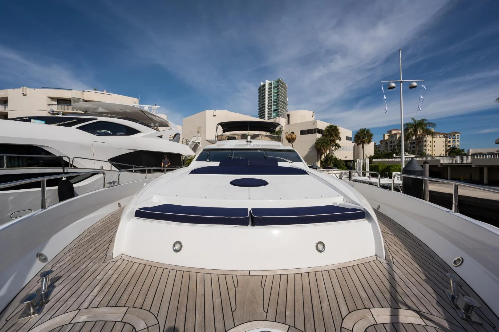 a white yacht in a dock aboard SS ARTS Yacht for Sale
