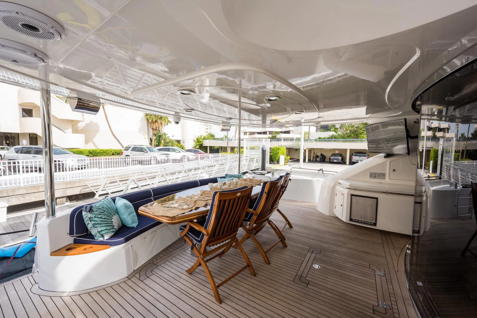 a table and chairs on a deck aboard SS ARTS Yacht for Sale