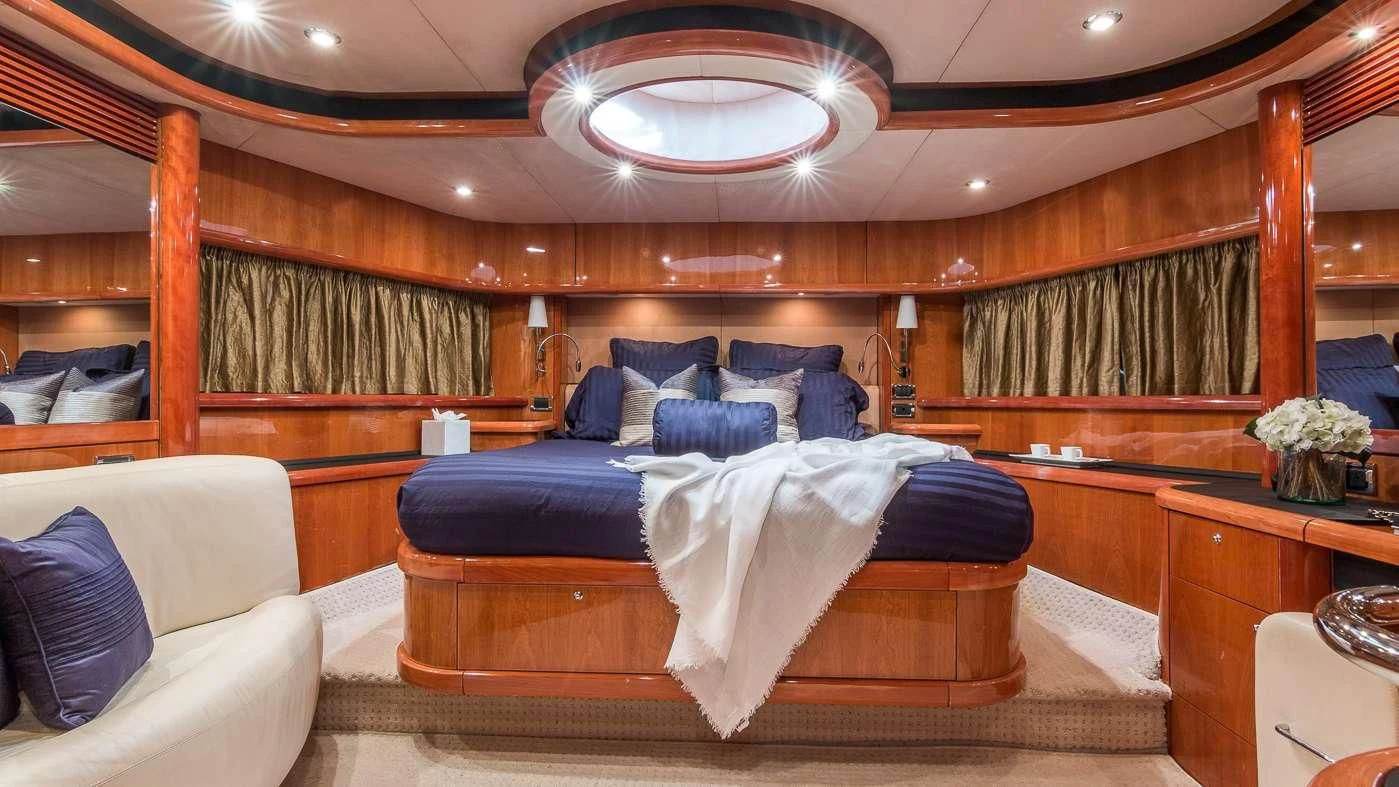 a bed in a room aboard SS ARTS Yacht for Sale