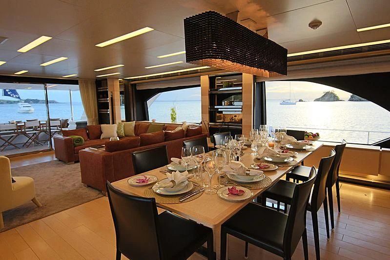 a dining room with a table and chairs aboard ESTEL OF IBIZA Yacht for Sale