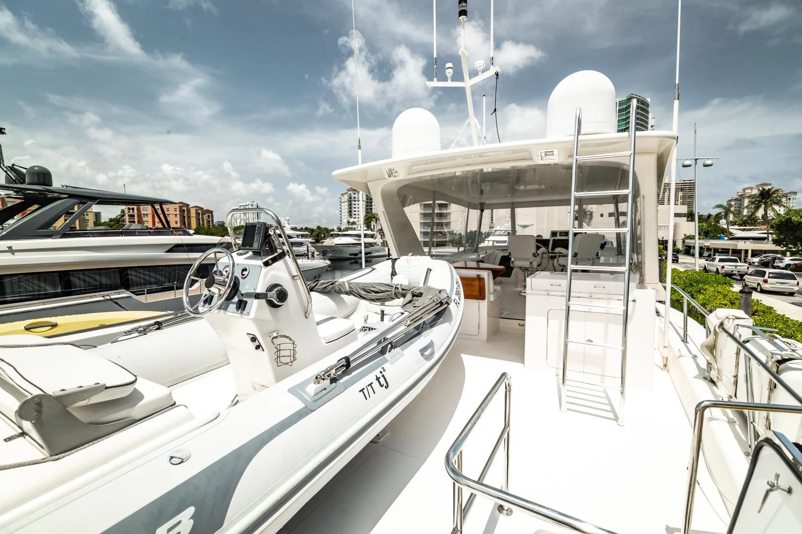 a boat docked at a pier aboard TJ SQUARED Yacht for Sale