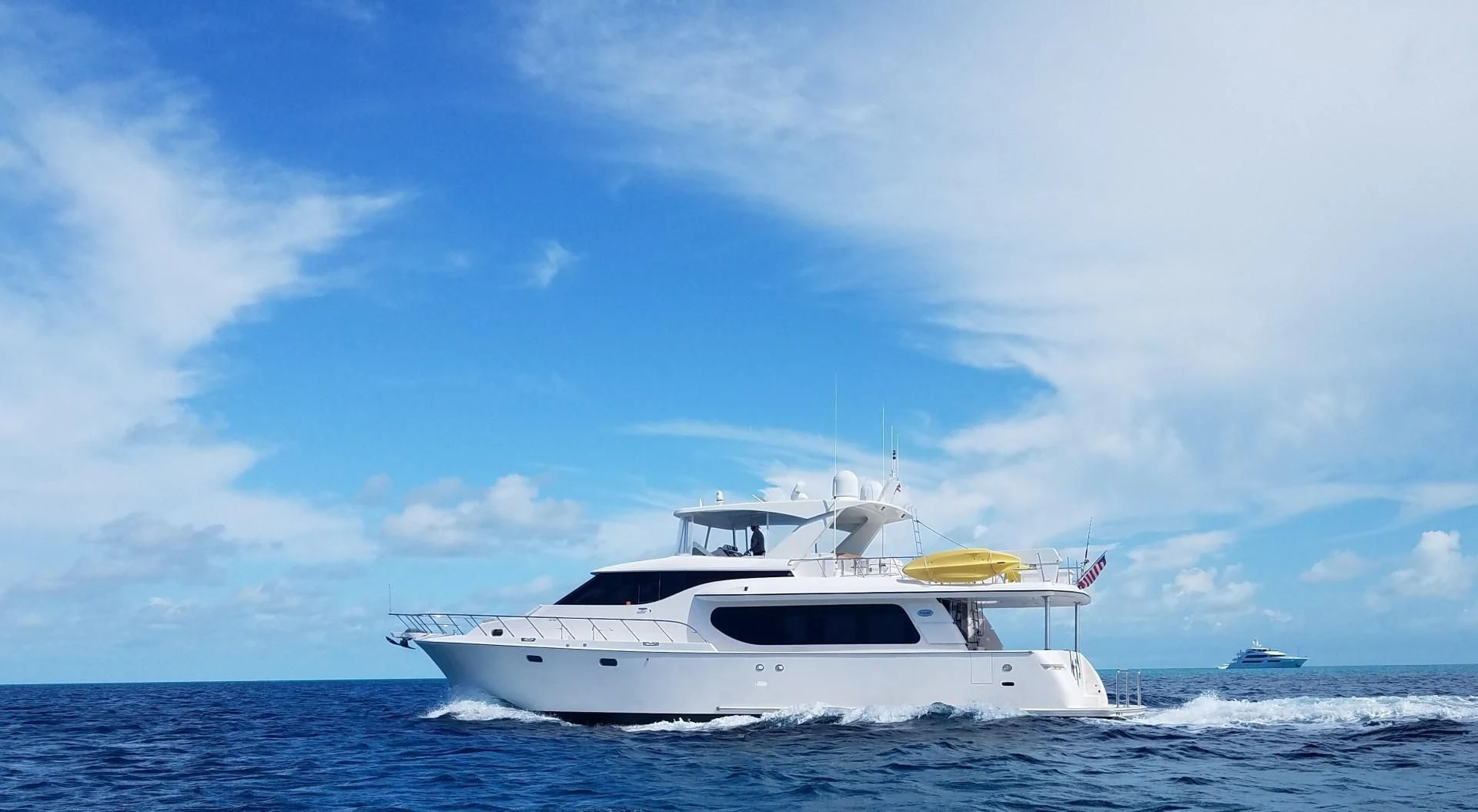 a white yacht in the water aboard TJ SQUARED Yacht for Sale