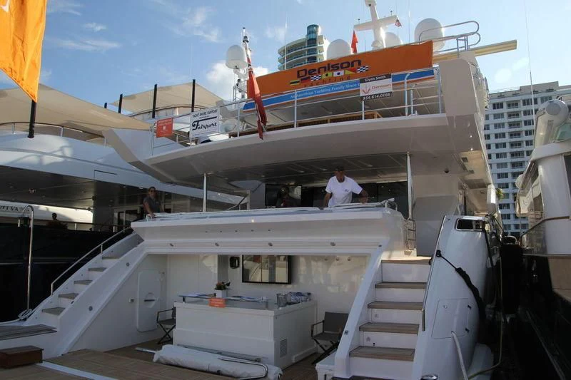 a large white boat with a ladder aboard EMINA Yacht for Charter