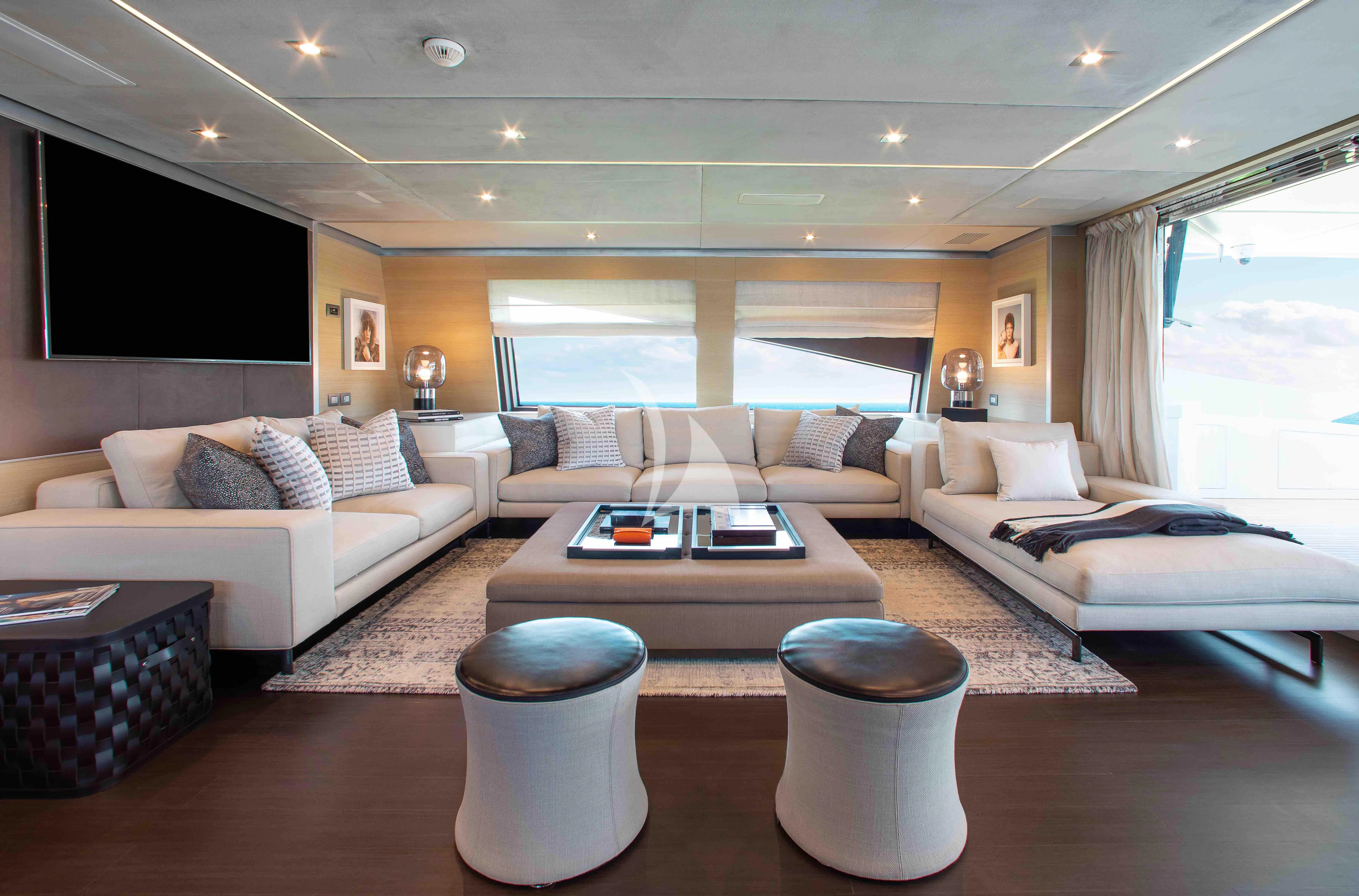 a living room with a couch and a coffee table aboard EMINA Yacht for Charter