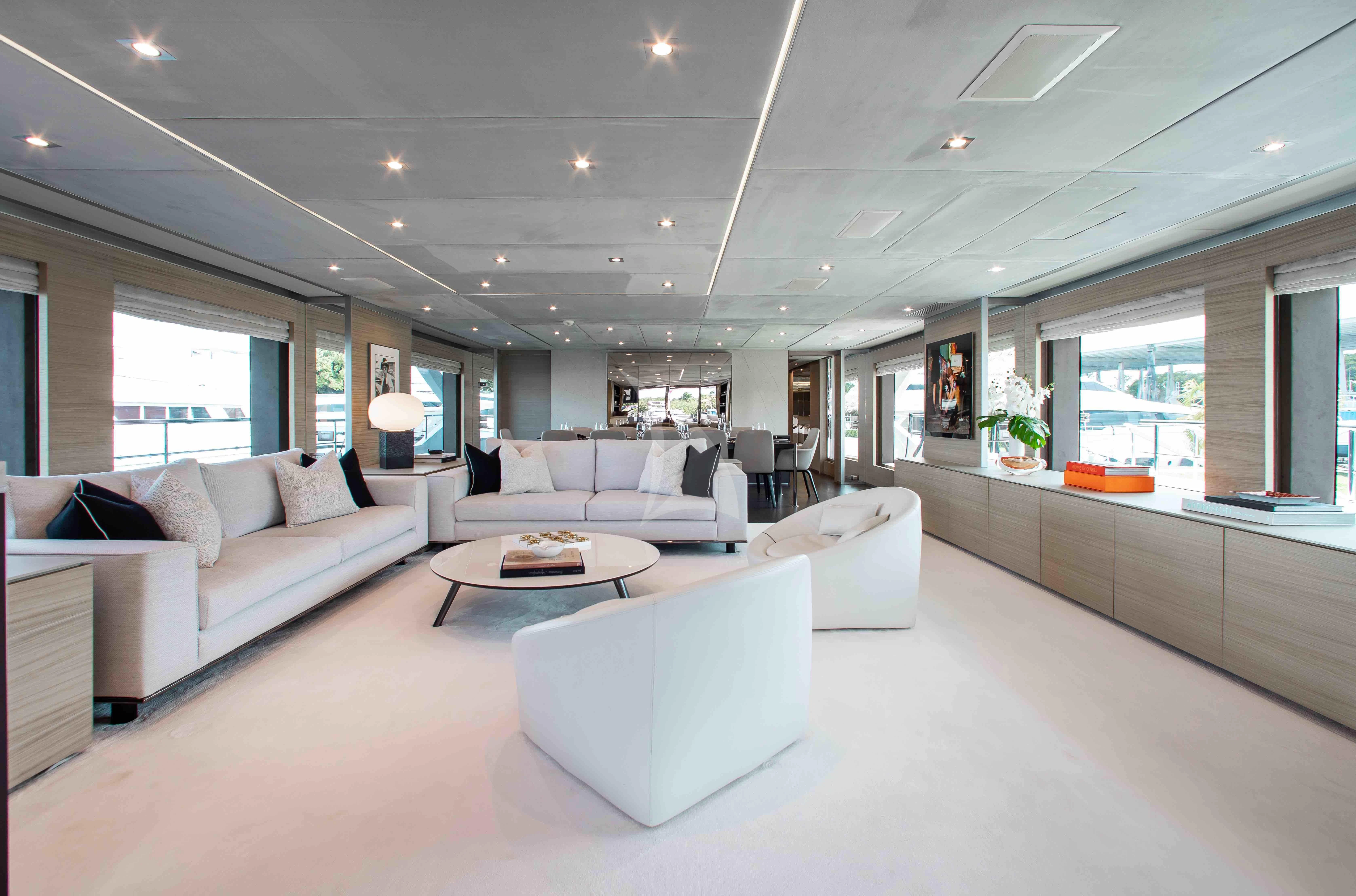 a living room with white furniture aboard EMINA Yacht for Charter