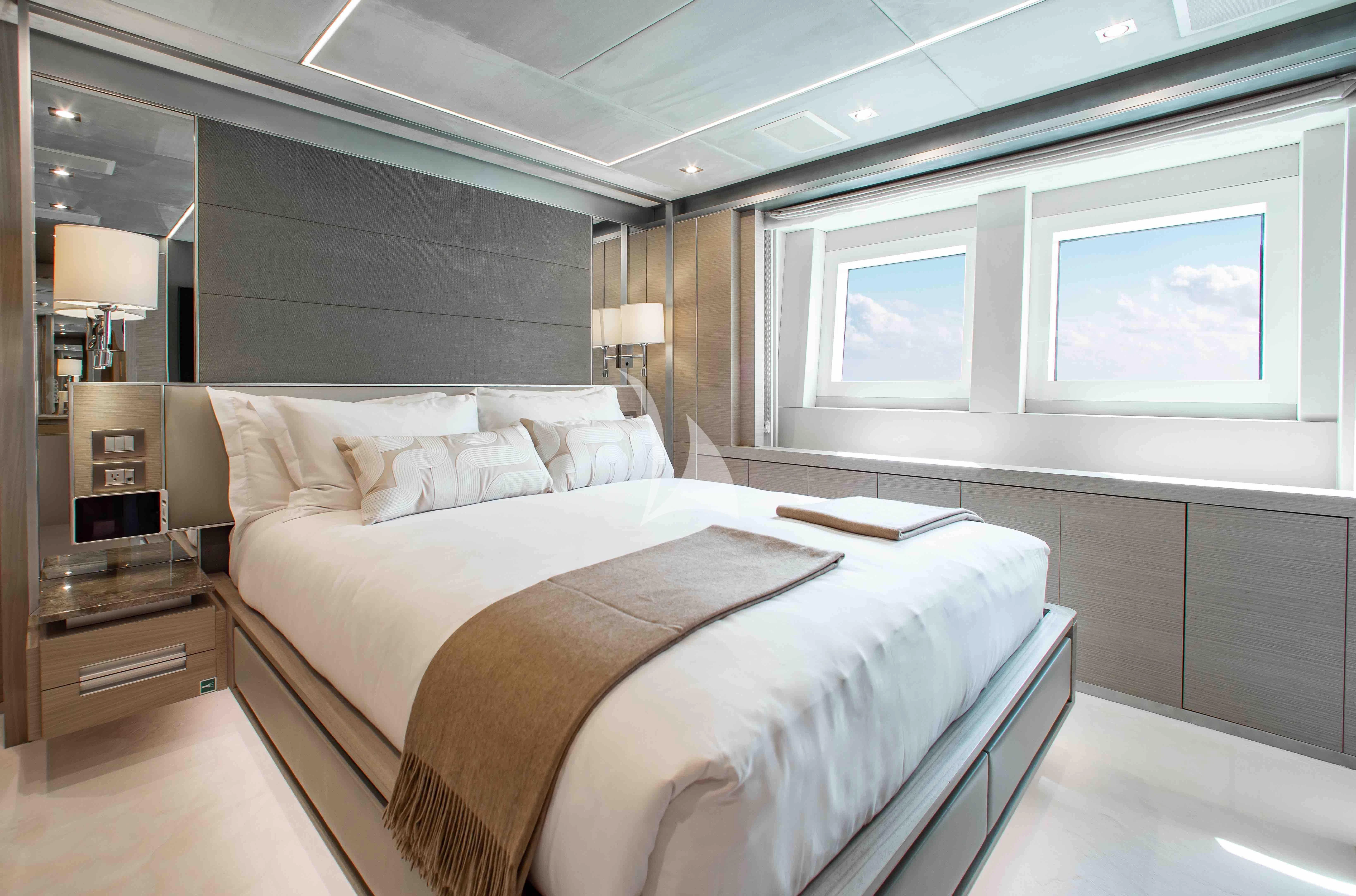 a large bed in a room aboard EMINA Yacht for Charter