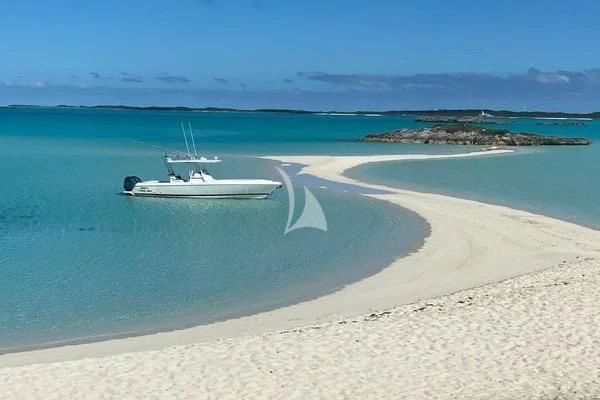 a boat on a beach aboard EMINA Yacht for Charter