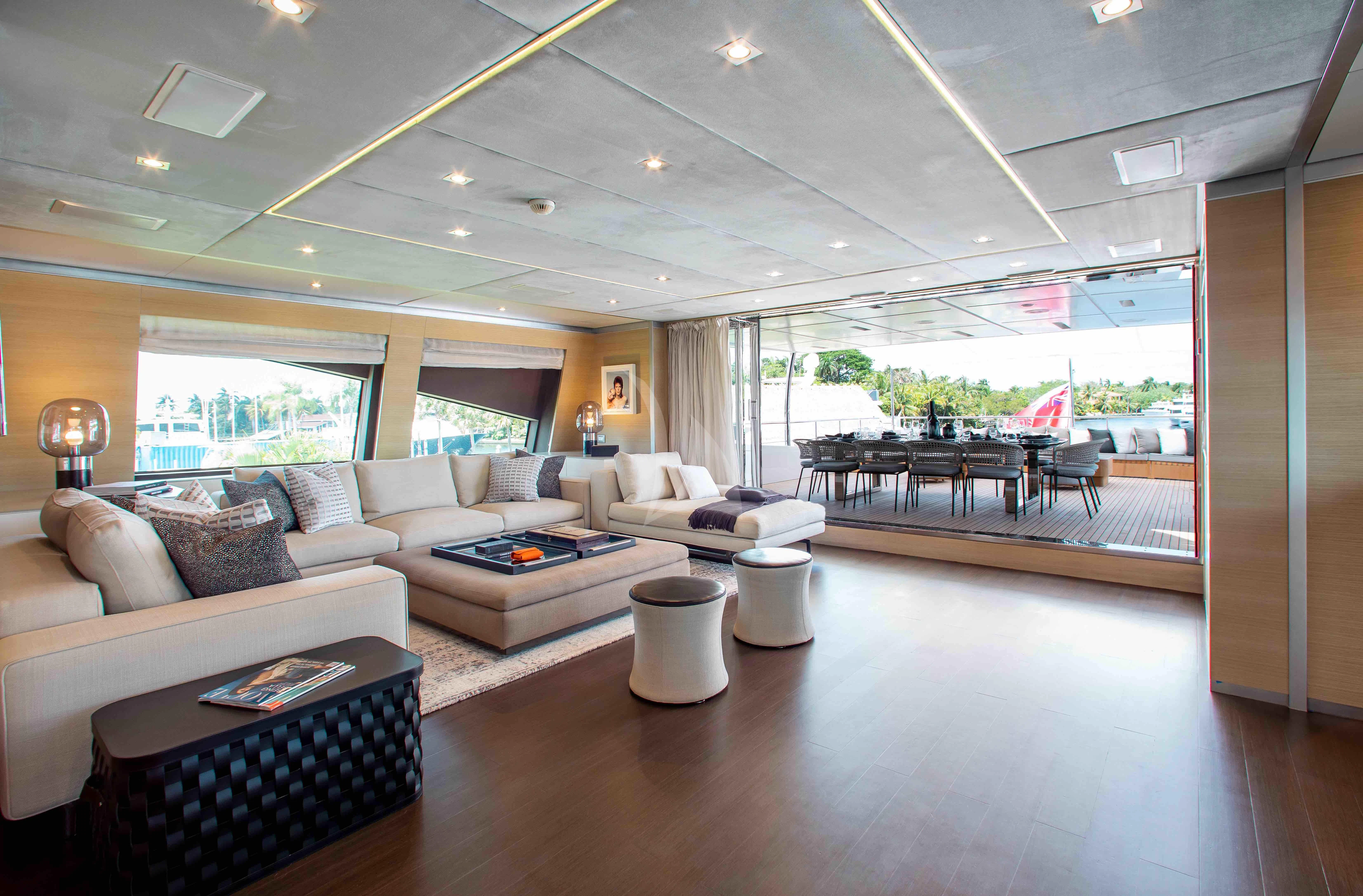a living room with a large window aboard EMINA Yacht for Charter