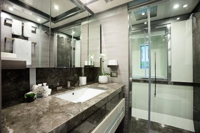 a bathroom with a marble counter top aboard EMINA Yacht for Charter