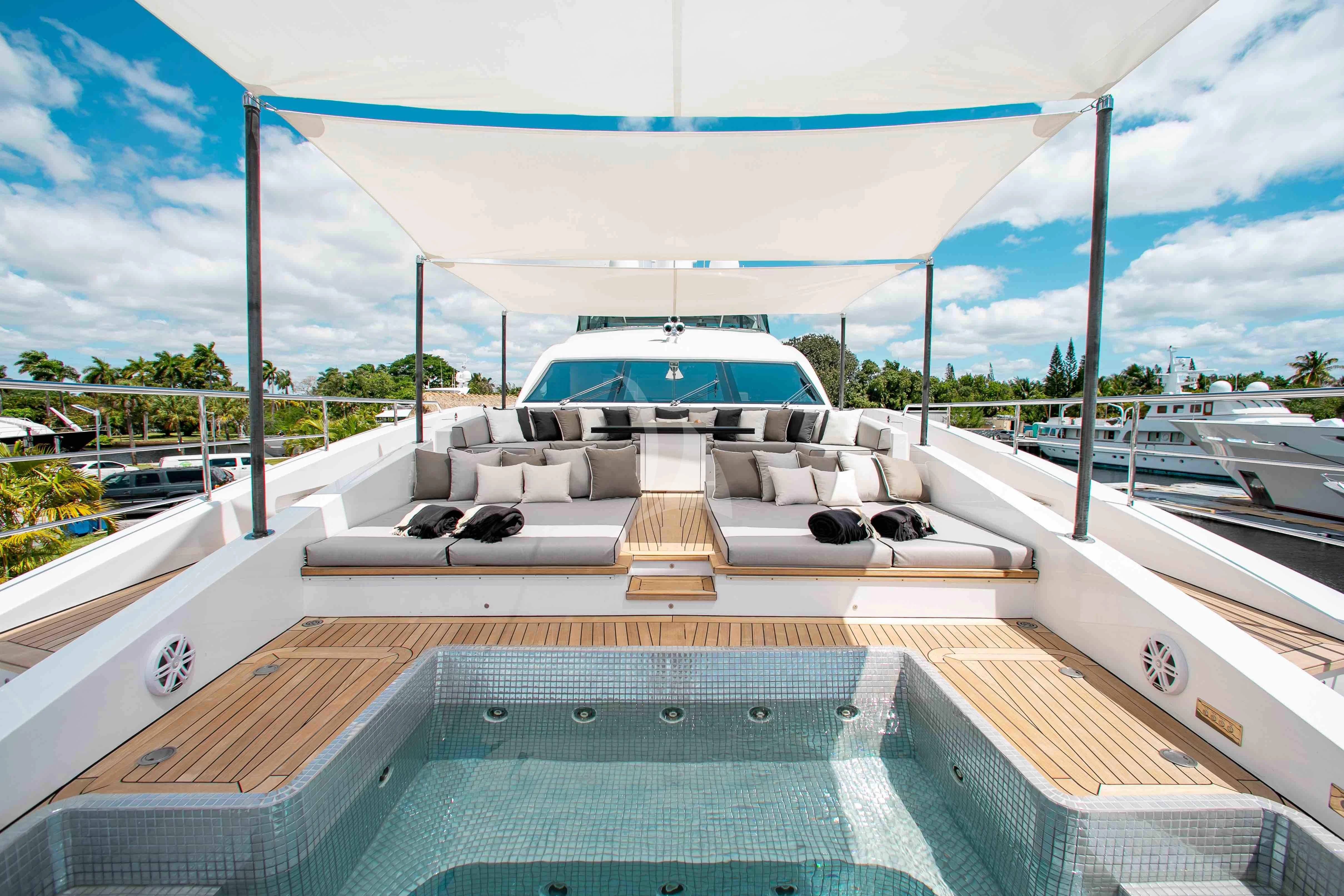 a deck with a boat on it aboard EMINA Yacht for Charter