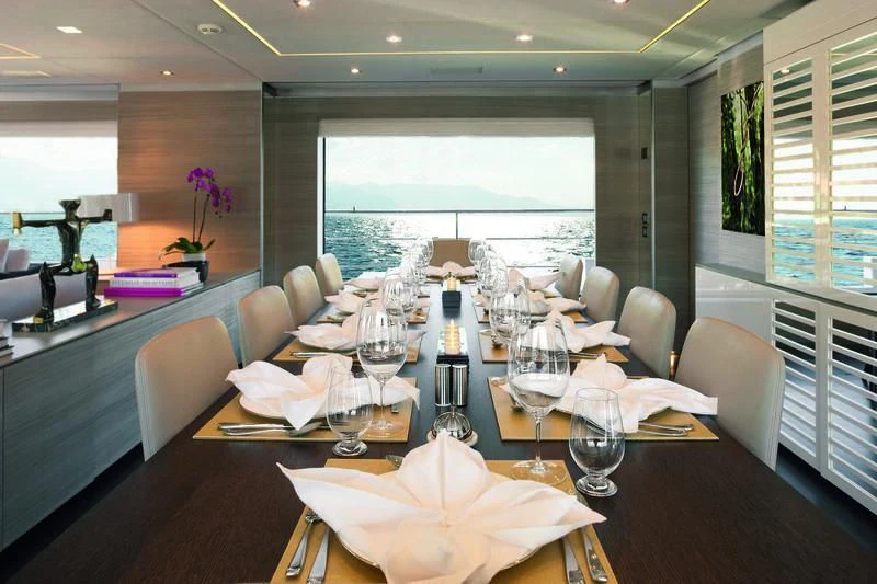 a dining room with a large table aboard EMINA Yacht for Charter