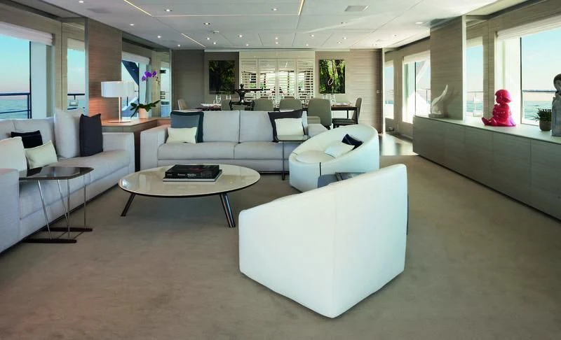 a living room with white furniture aboard EMINA Yacht for Charter