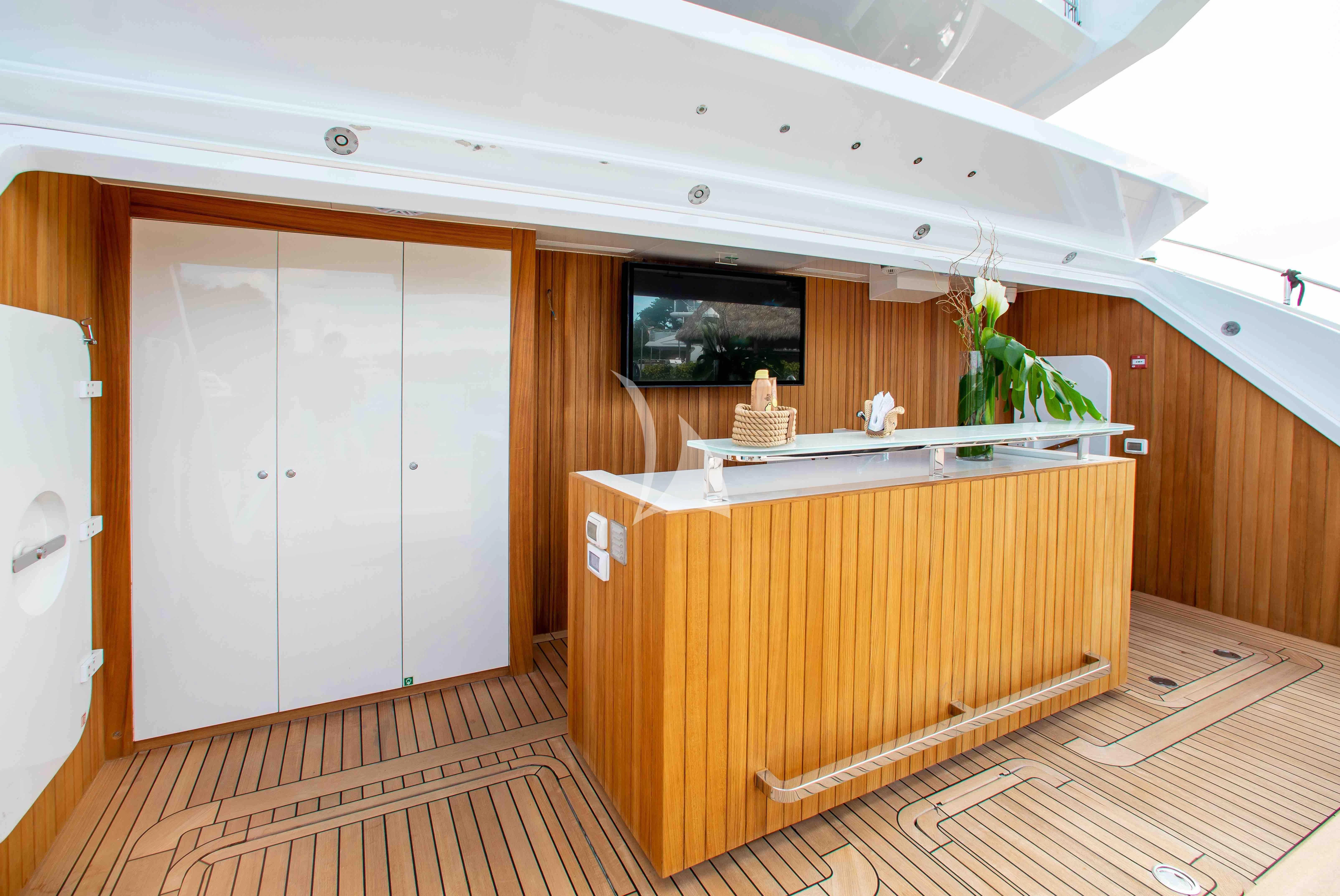 a wooden cabinet in a room aboard EMINA Yacht for Charter