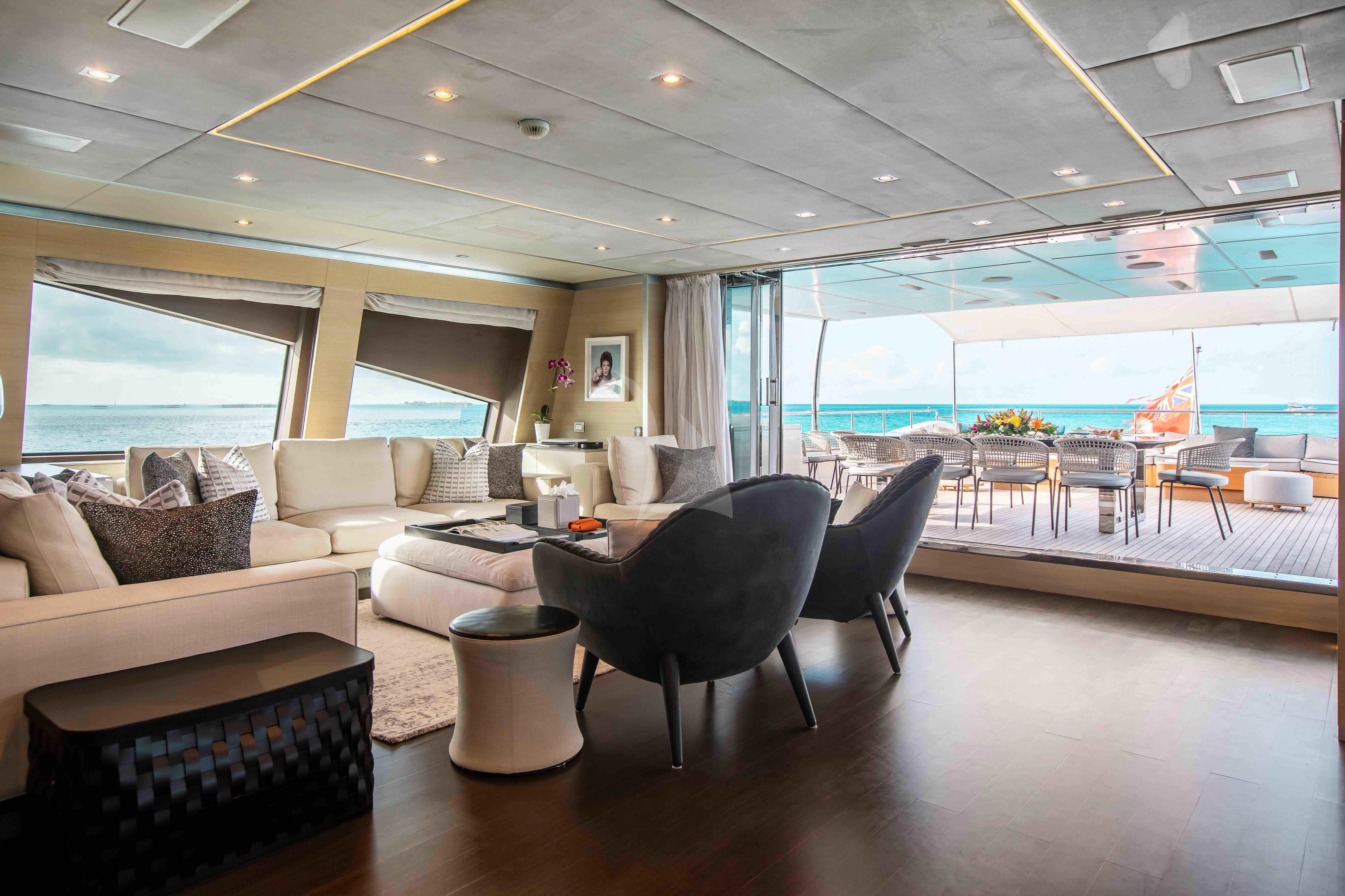 a room with a couch and a table and chairs aboard EMINA Yacht for Charter