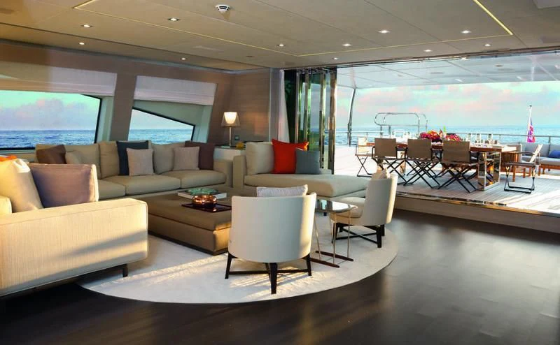 a living room with a large window aboard EMINA Yacht for Charter