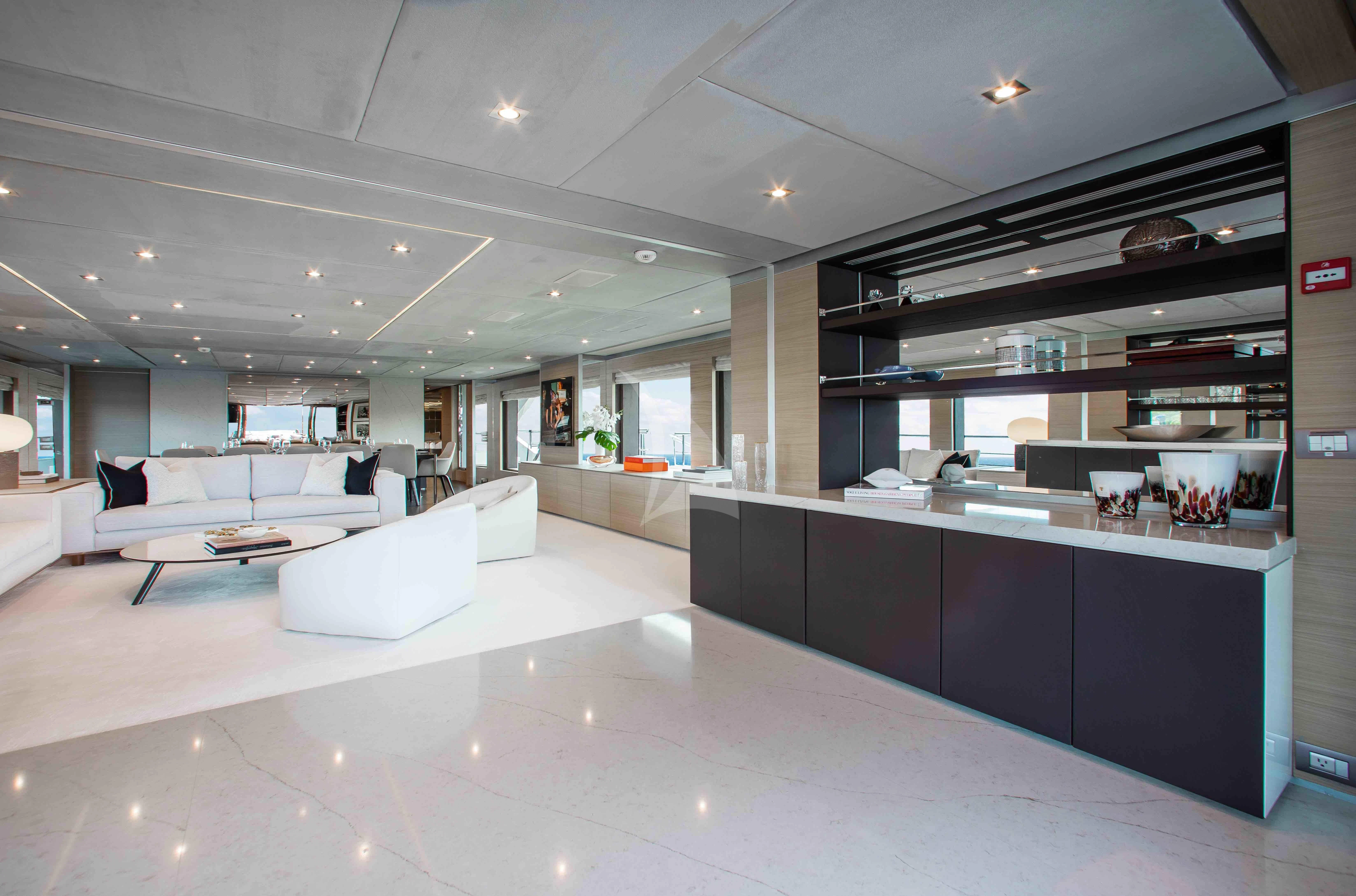 a large room with white furniture aboard EMINA Yacht for Charter