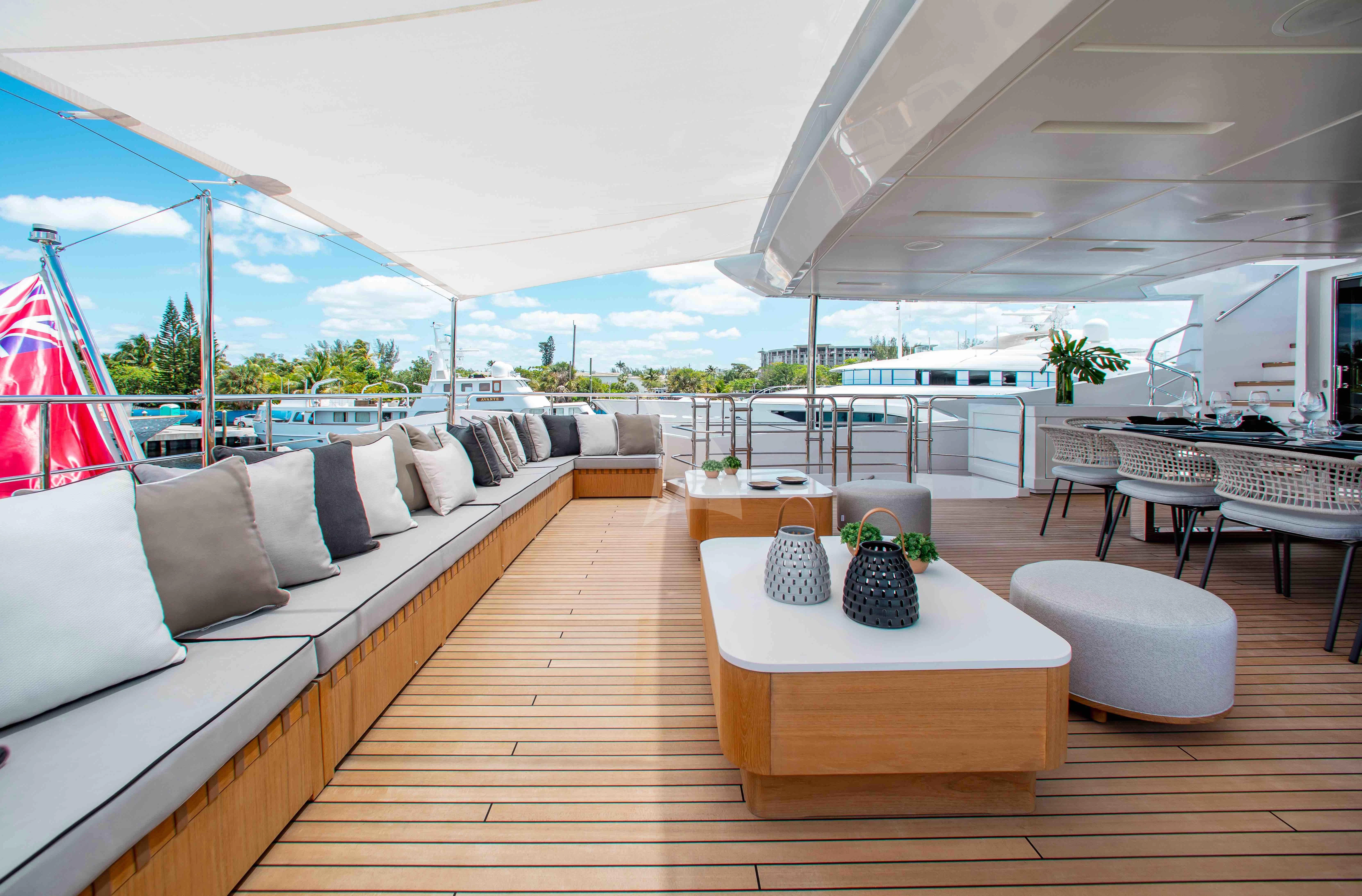 a living room with a large patio aboard EMINA Yacht for Charter
