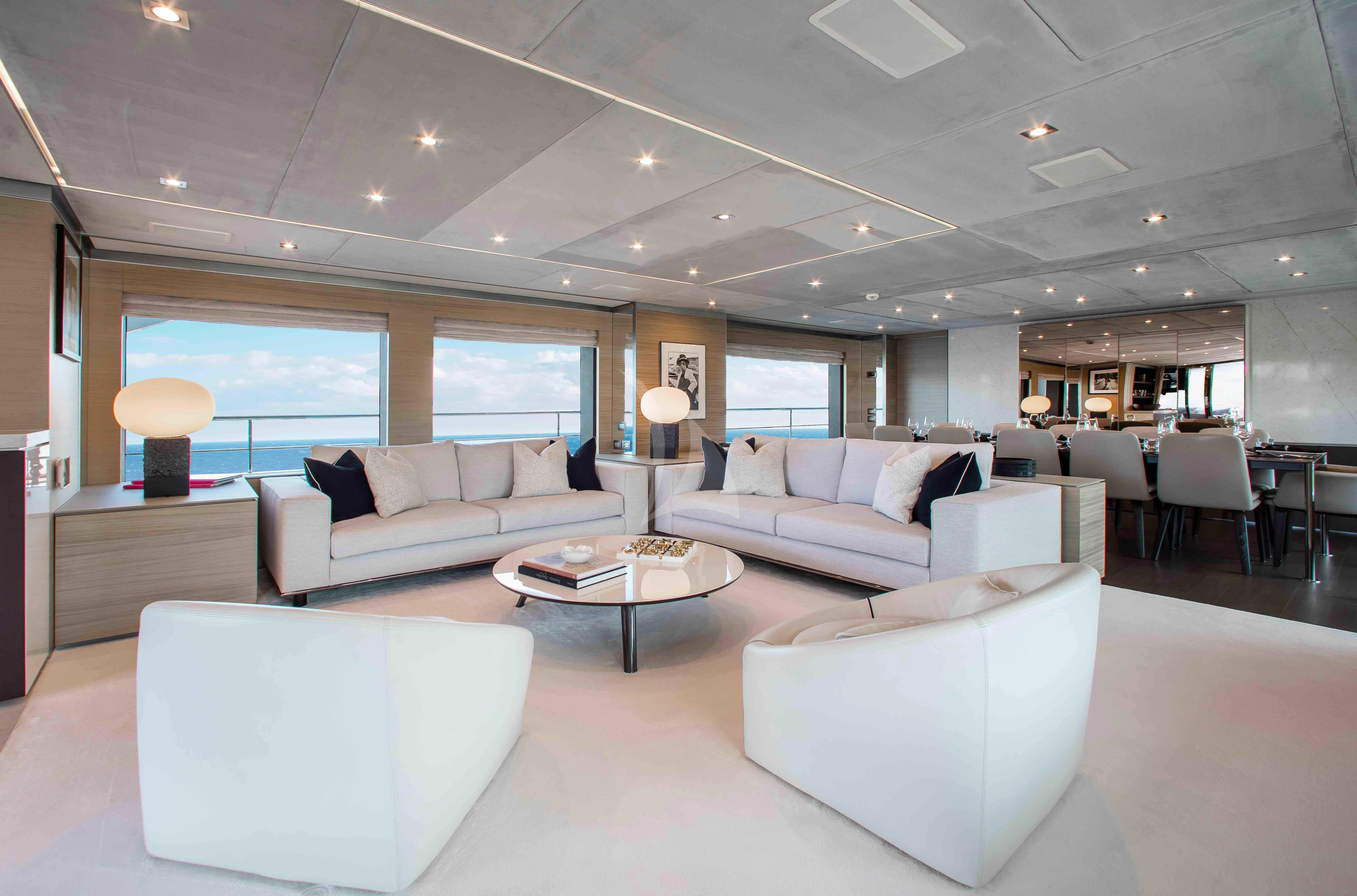 a living room with white furniture aboard EMINA Yacht for Charter