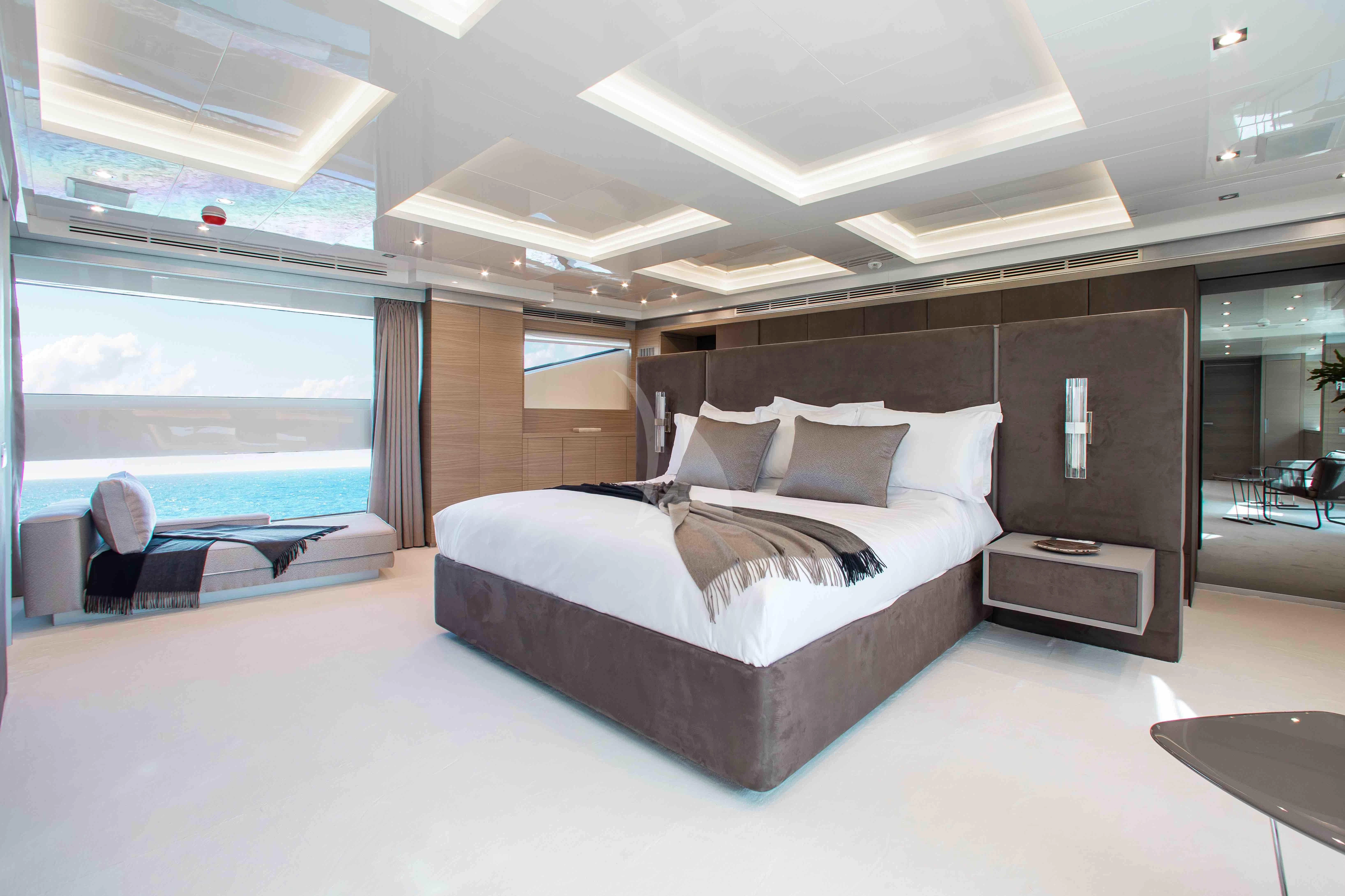 a large bed in a room aboard EMINA Yacht for Charter
