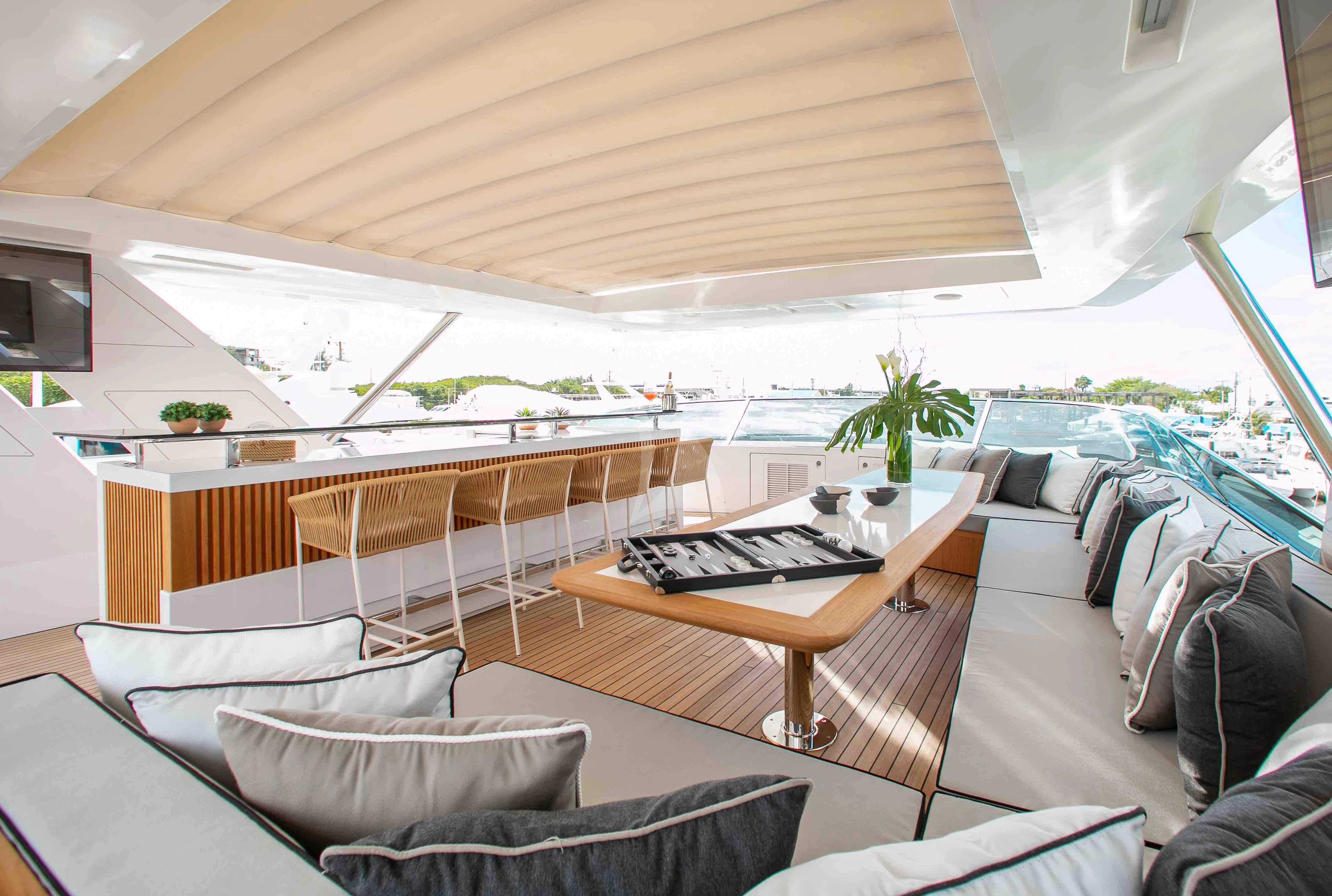 a room with a couch and a television aboard EMINA Yacht for Charter