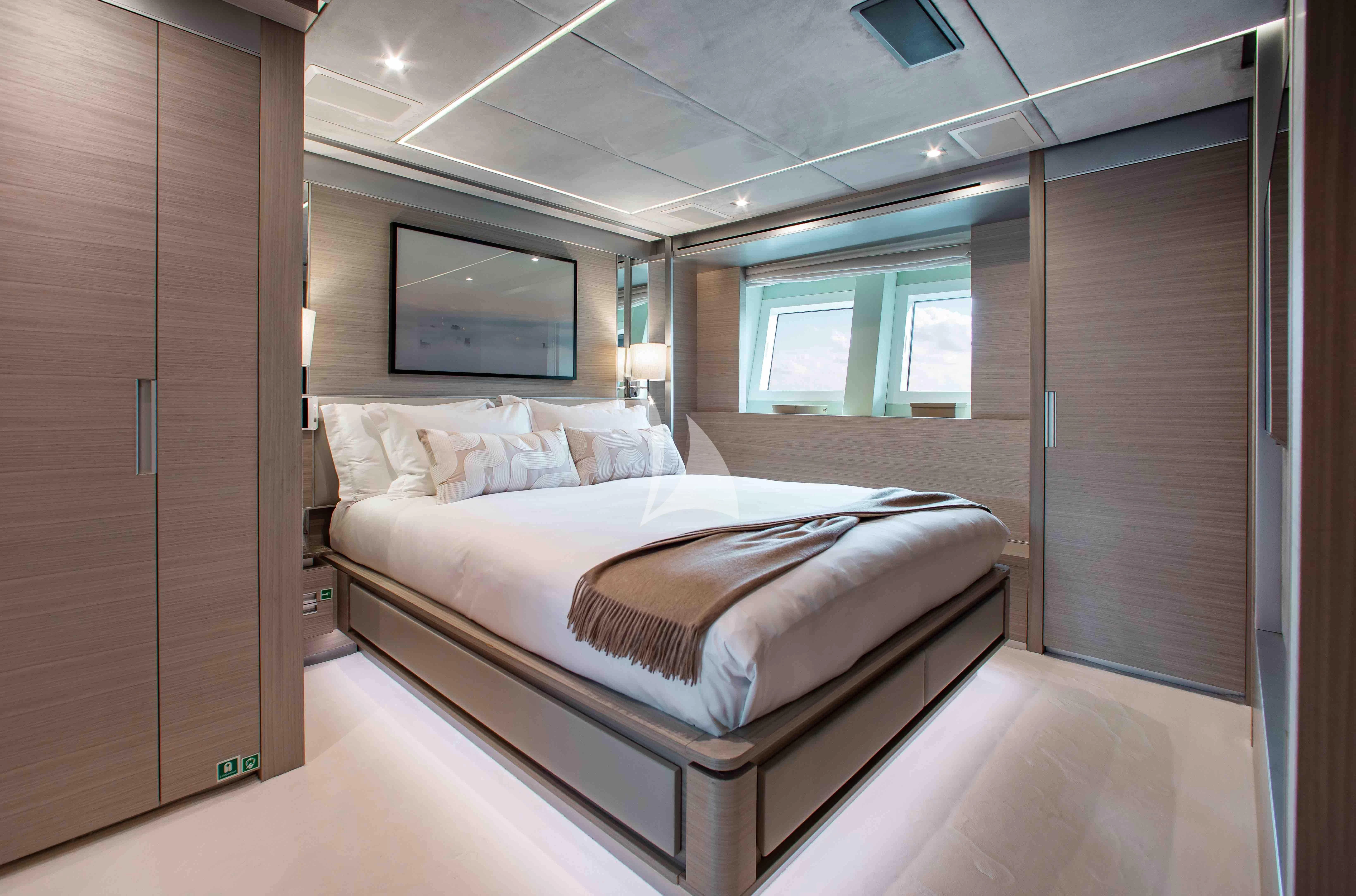 a bed in a room aboard EMINA Yacht for Charter