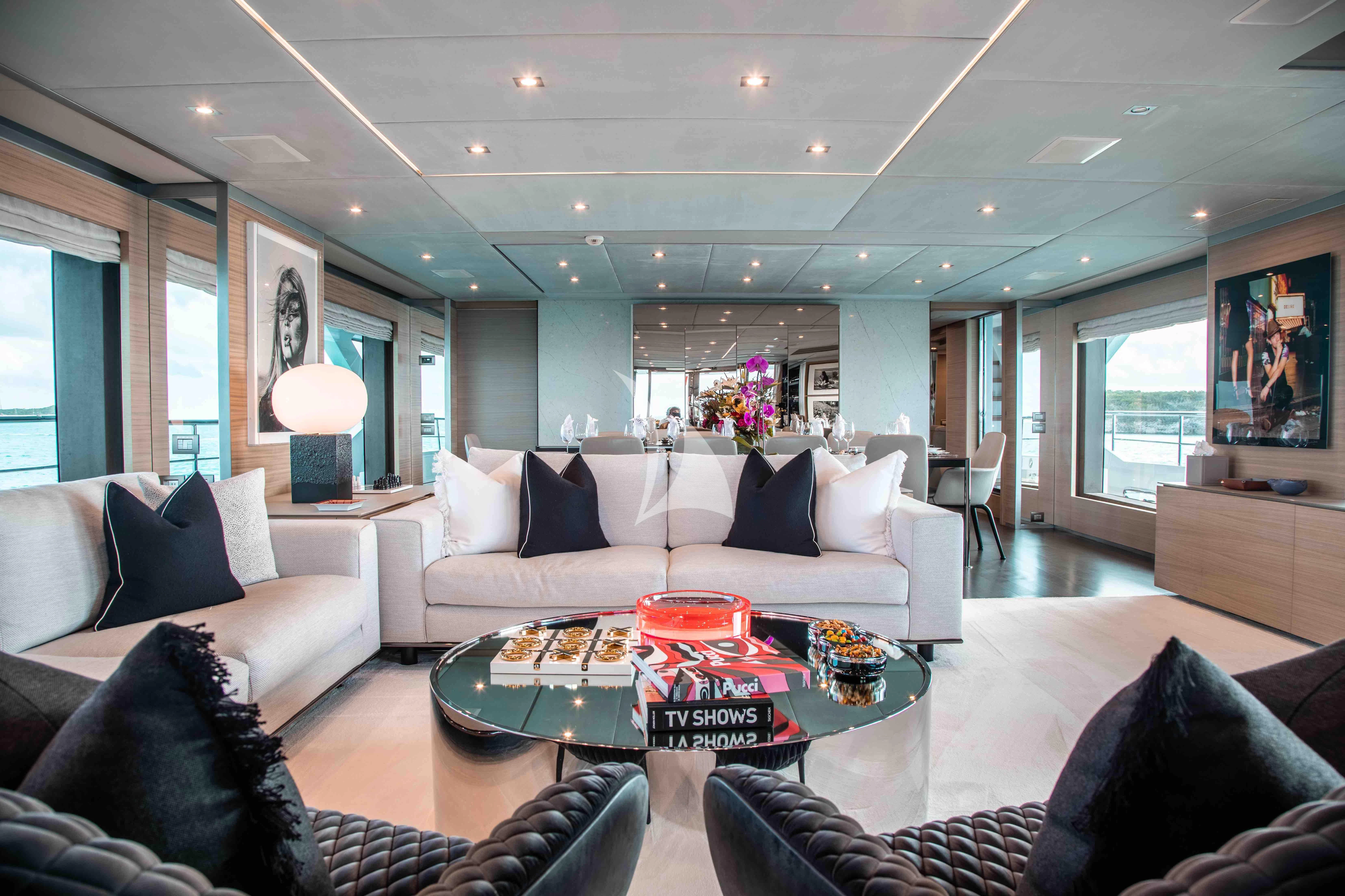 a living room with a large window aboard EMINA Yacht for Charter
