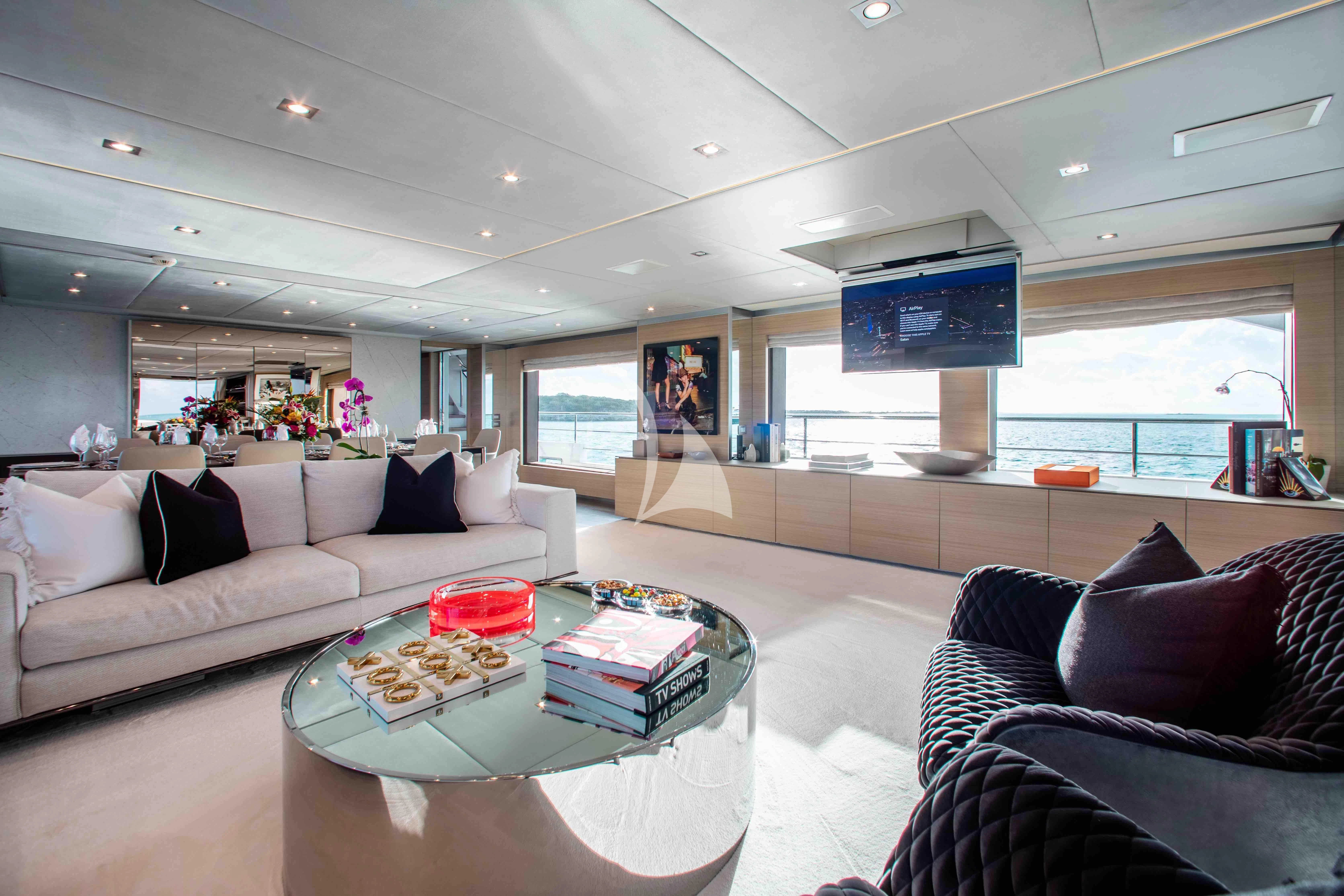 a living room with a large window aboard EMINA Yacht for Charter