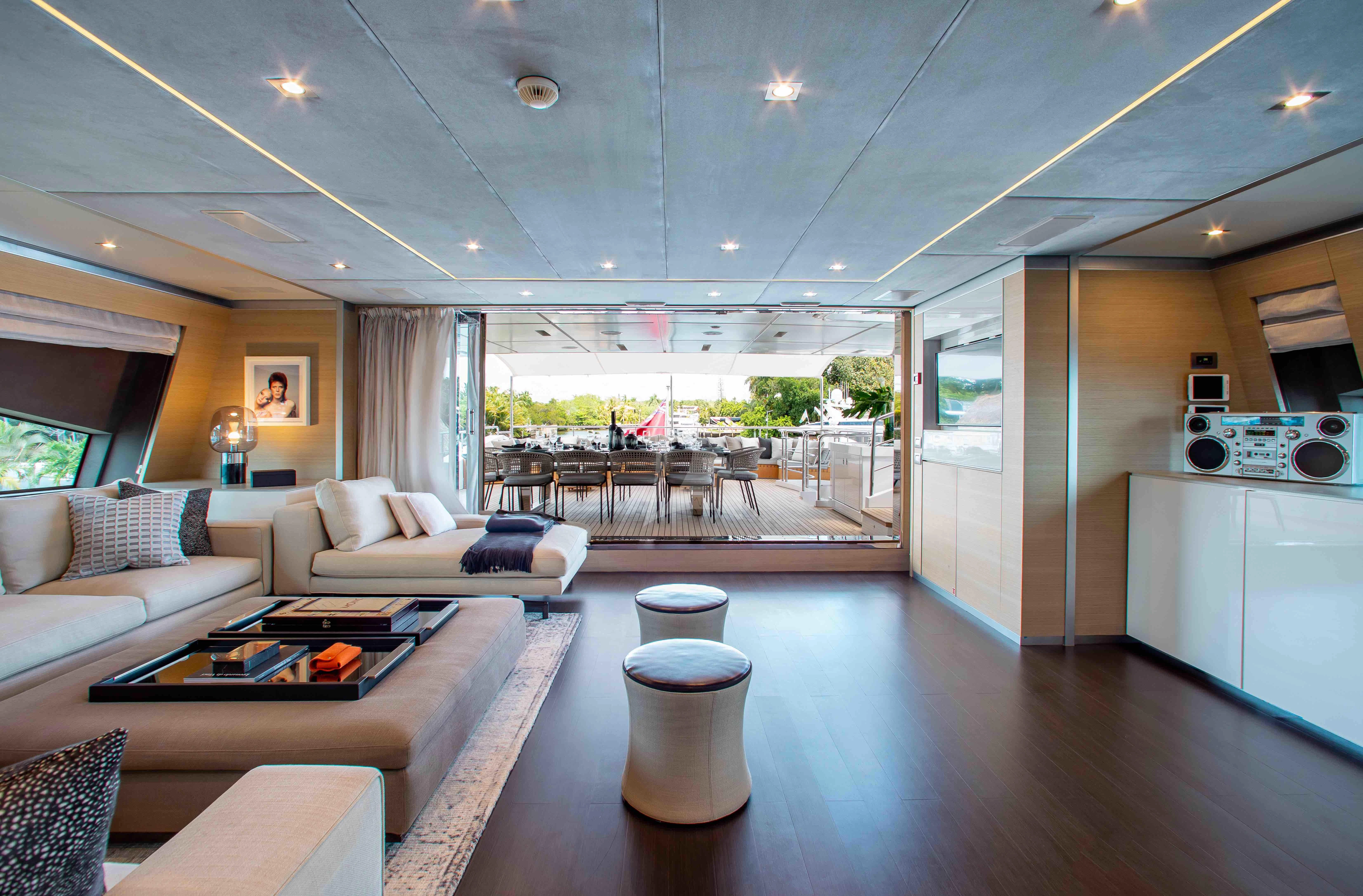 a living room with a large window aboard EMINA Yacht for Charter