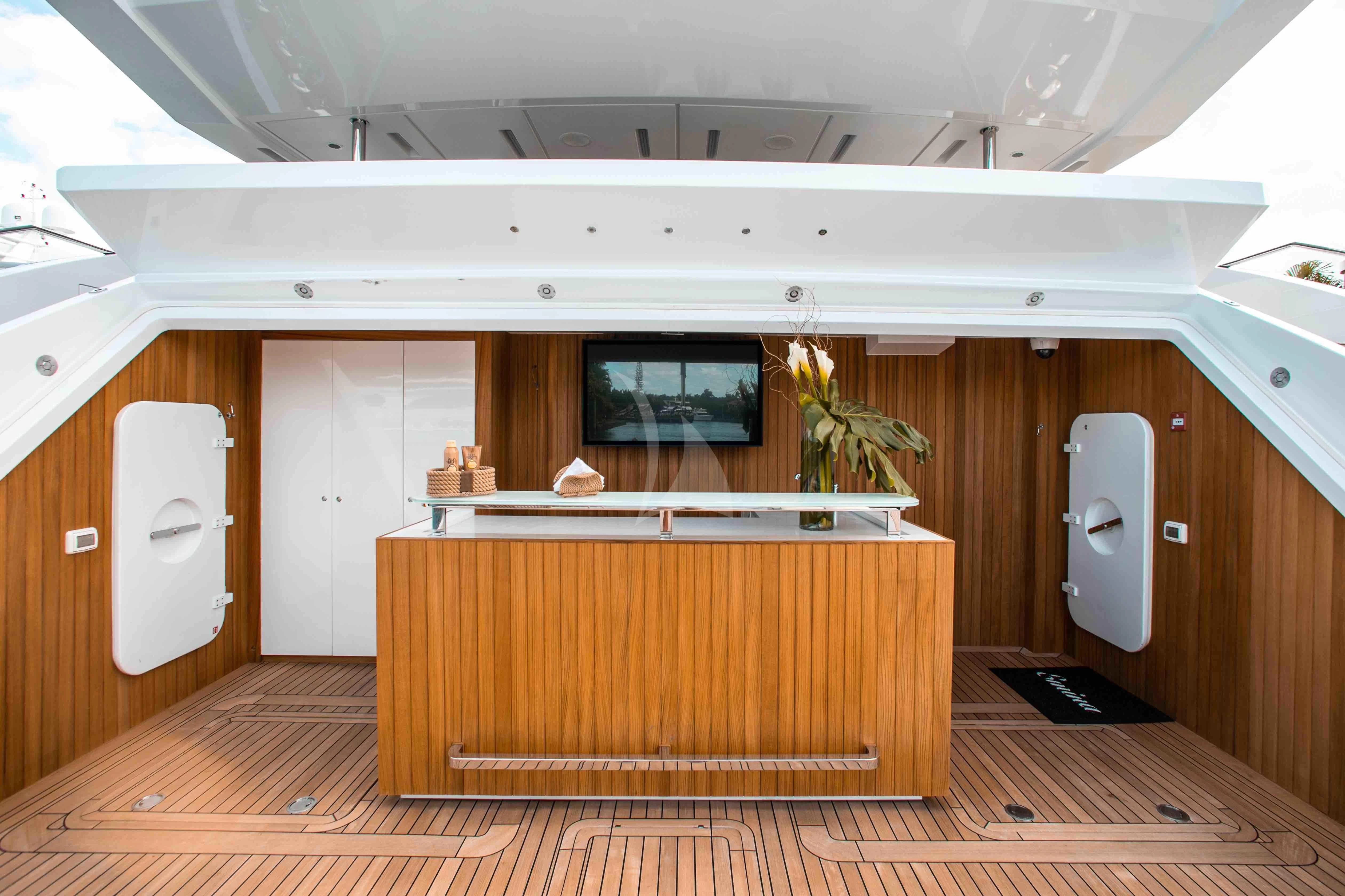 a bathroom with wooden cabinets aboard EMINA Yacht for Charter