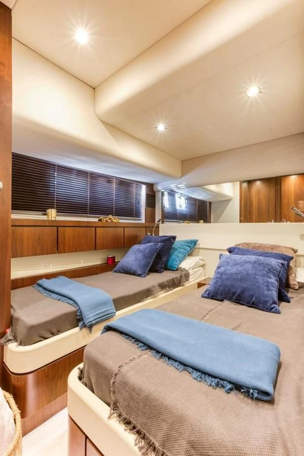 a room with a bed and a window aboard LANA 1 Yacht for Sale
