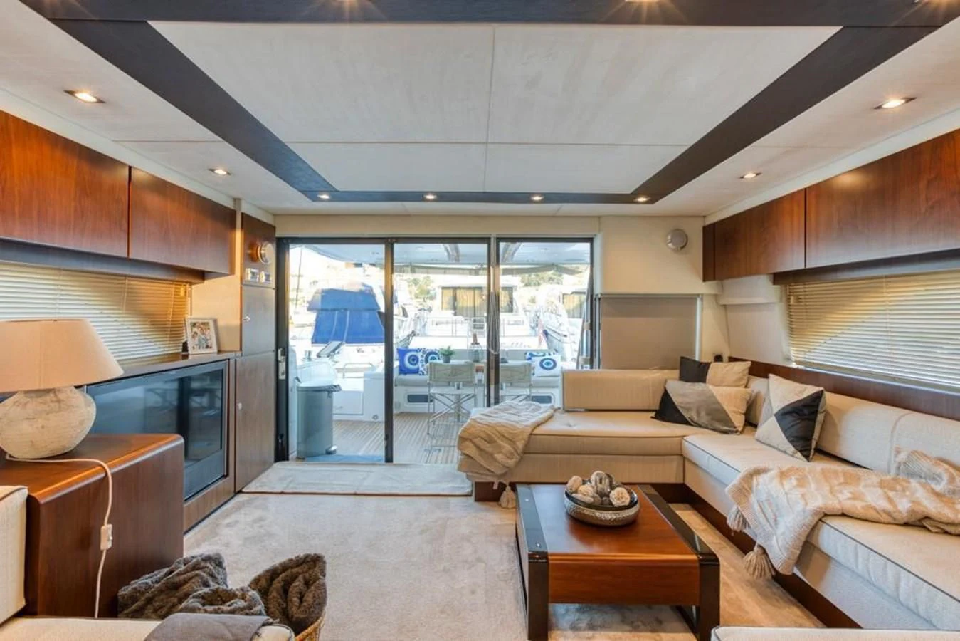 a living room with a large glass door aboard LANA 1 Yacht for Sale