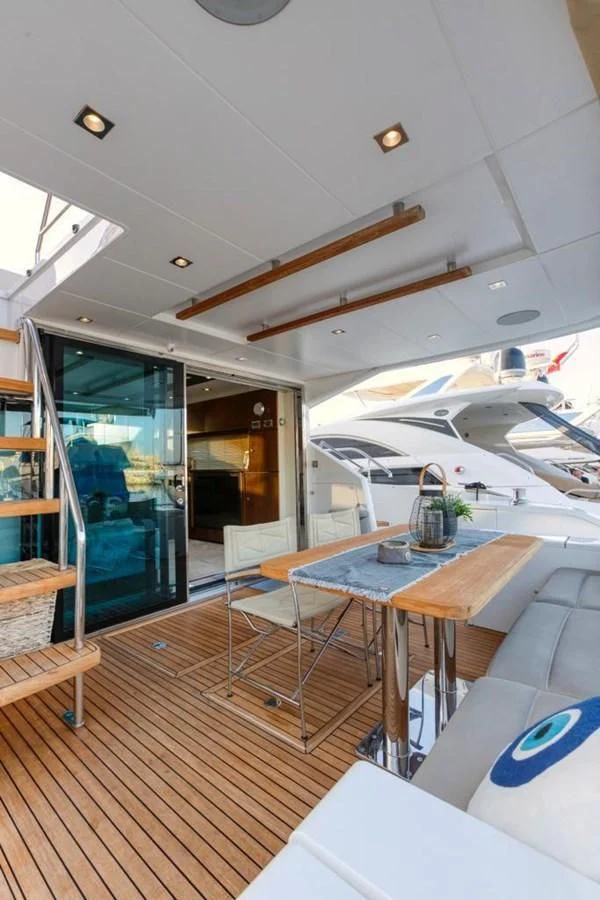 a room with a table and chairs aboard LANA 1 Yacht for Sale