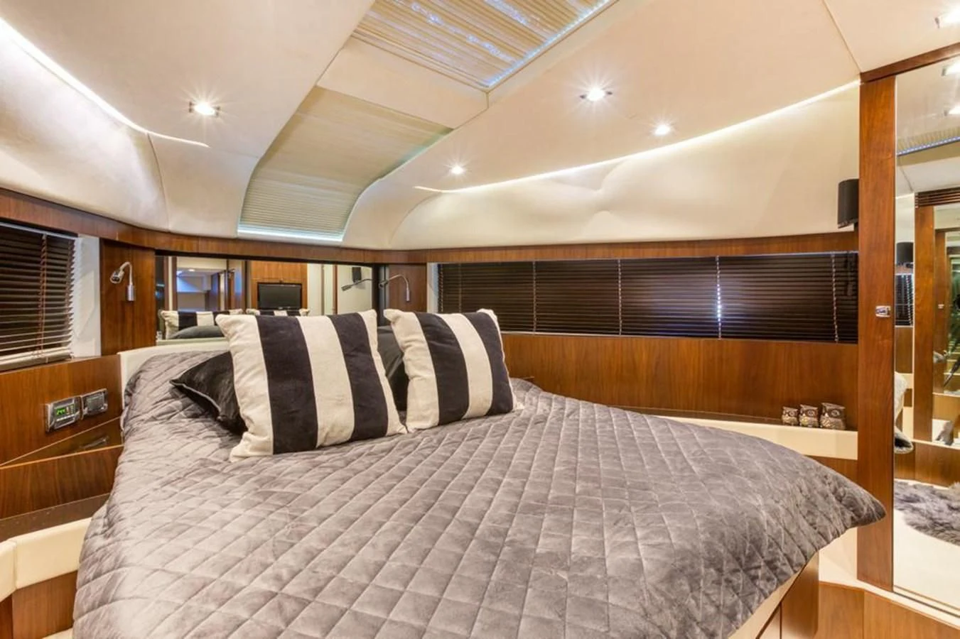 a bed with a white comforter aboard LANA 1 Yacht for Sale