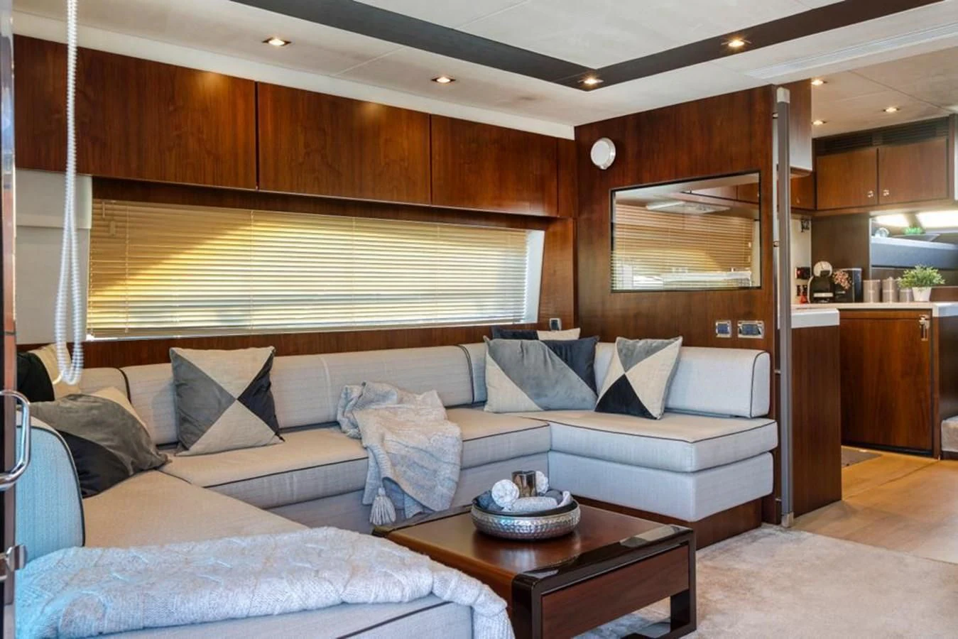 a living room with a couch and a coffee table aboard LANA 1 Yacht for Sale