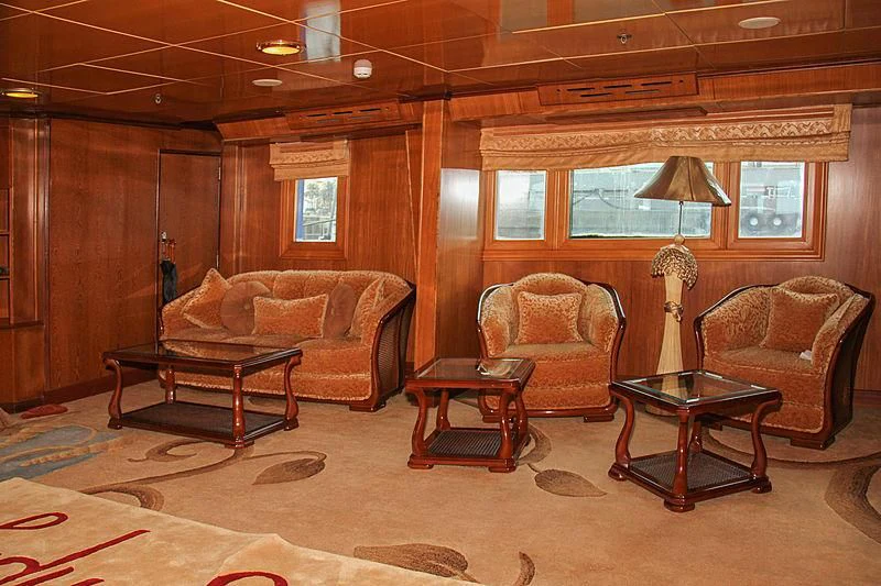 a living room with a couch and a coffee table aboard PRINCESS OF PALAU Yacht for Sale