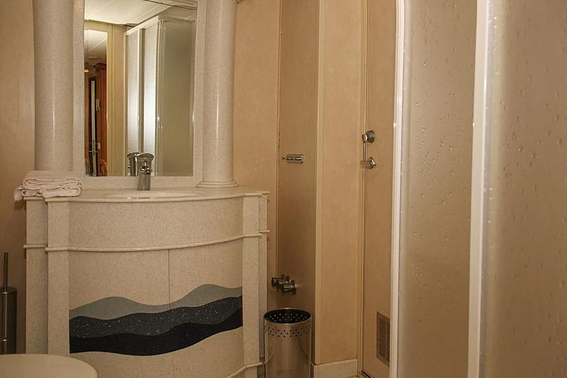 a bathroom with a tub and a sink aboard PRINCESS OF PALAU Yacht for Sale